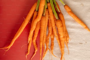 a bunch of carrots sitting on top of a table