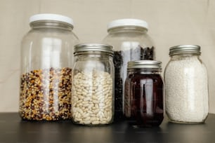 a group of jars filled with different types of food