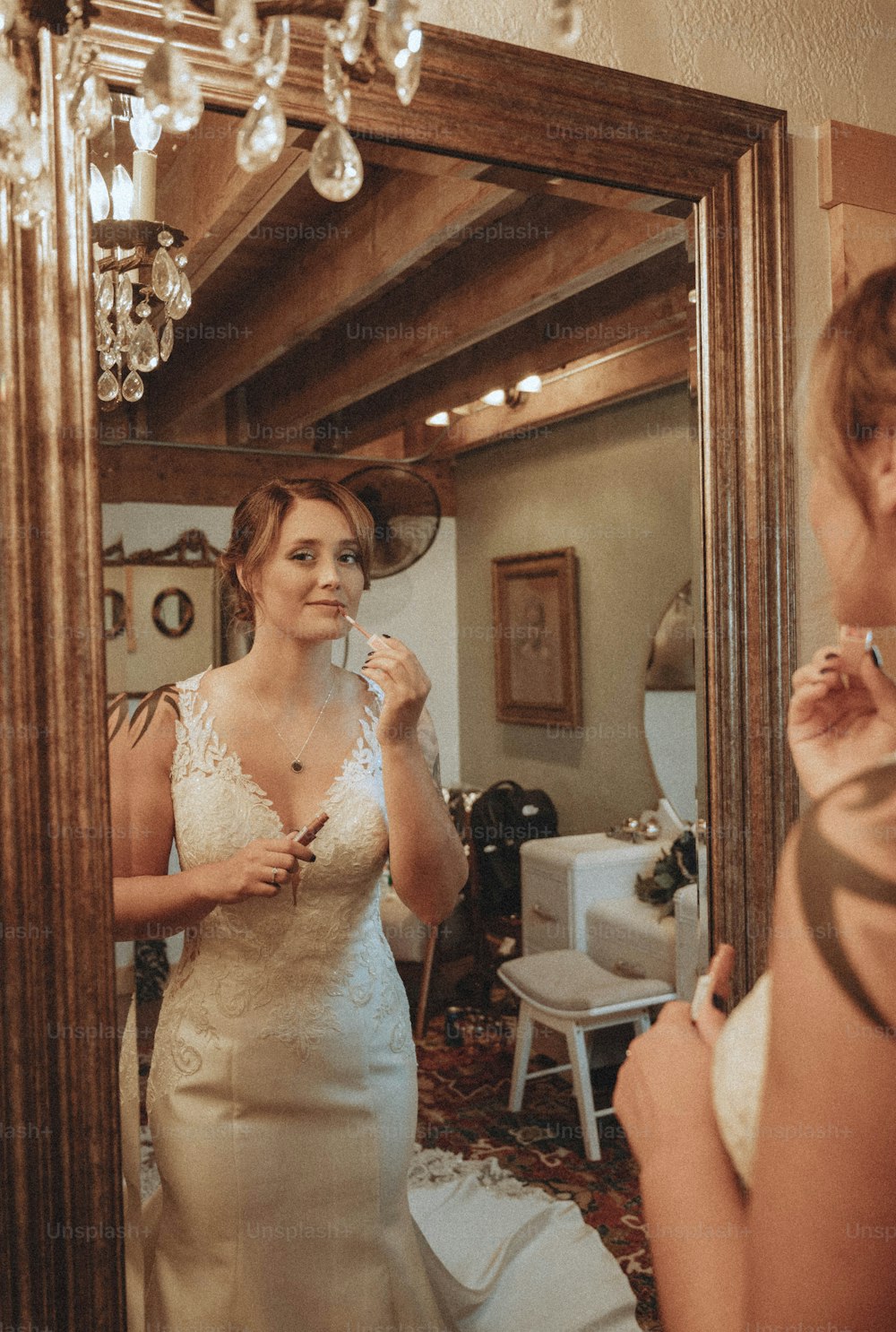 a woman standing in front of a mirror brushing her teeth