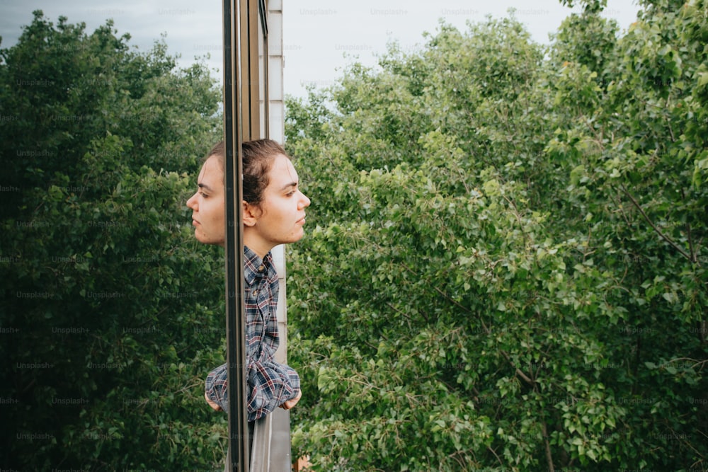 a woman looking out of a train window