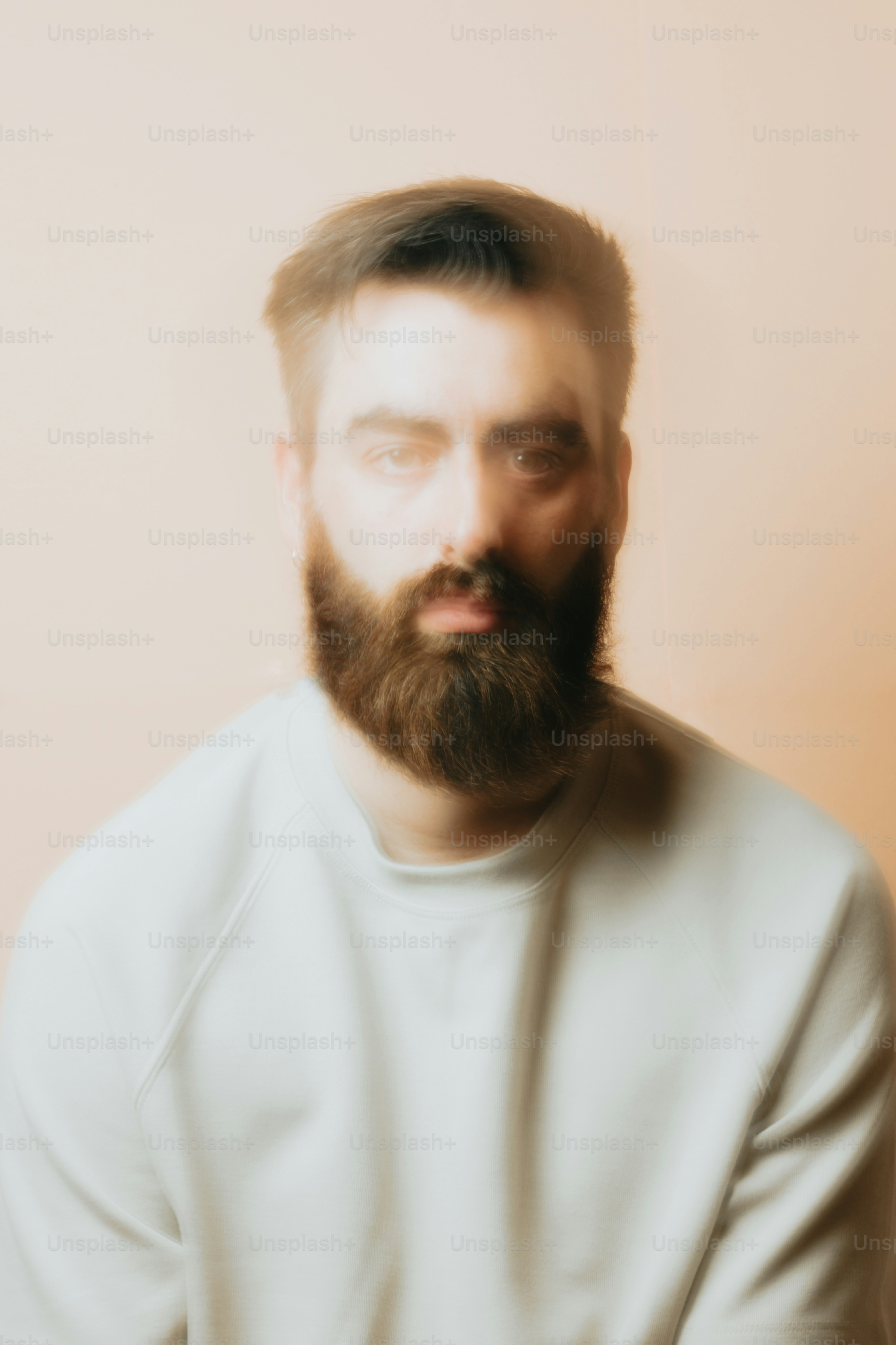 a man with a beard and a white shirt