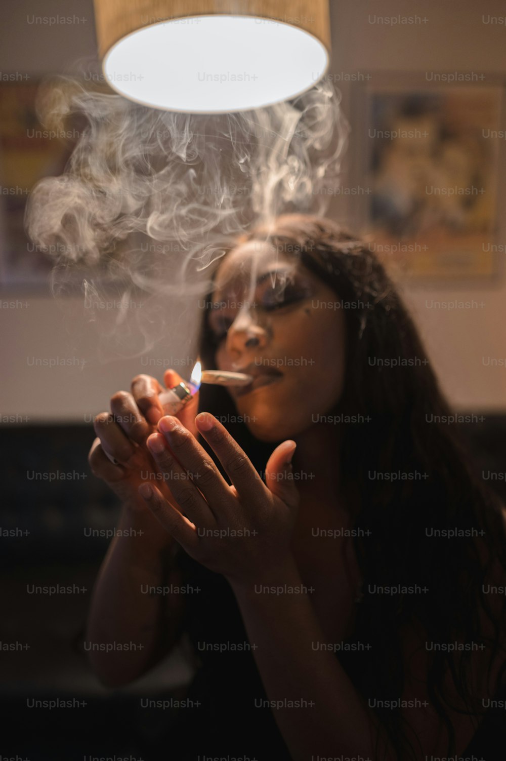 a woman smoking a cigarette in a living room