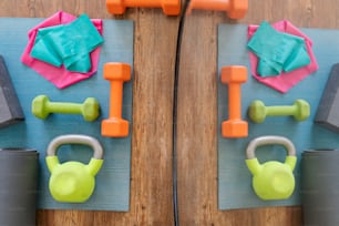 a close up of a gym mat with dumbs and exercise equipment
