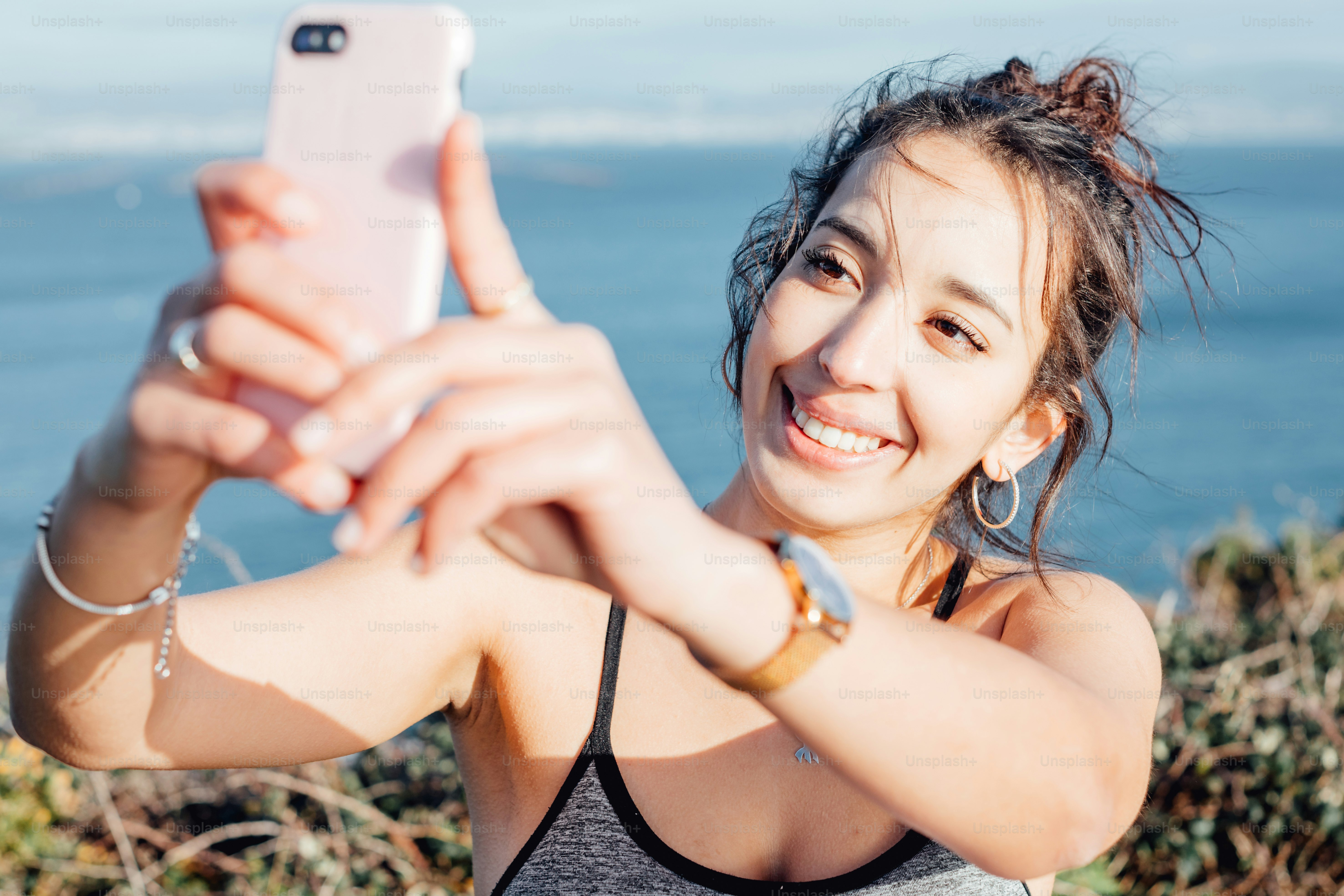 a woman taking a picture with her cell phone