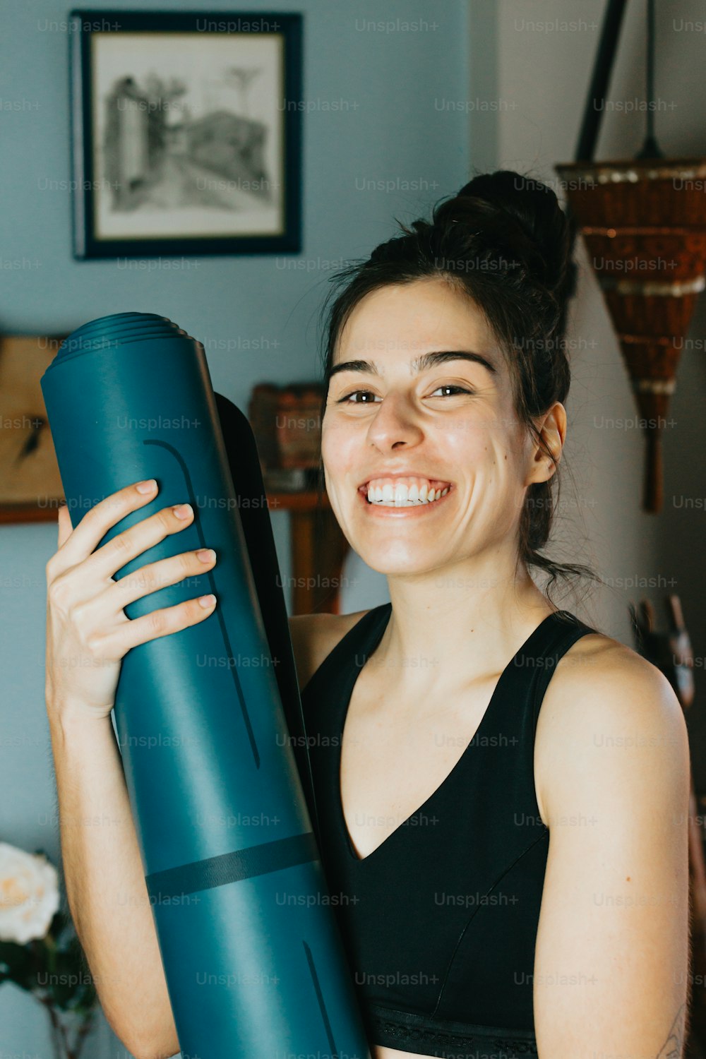 a woman holding a large blue object in her hands