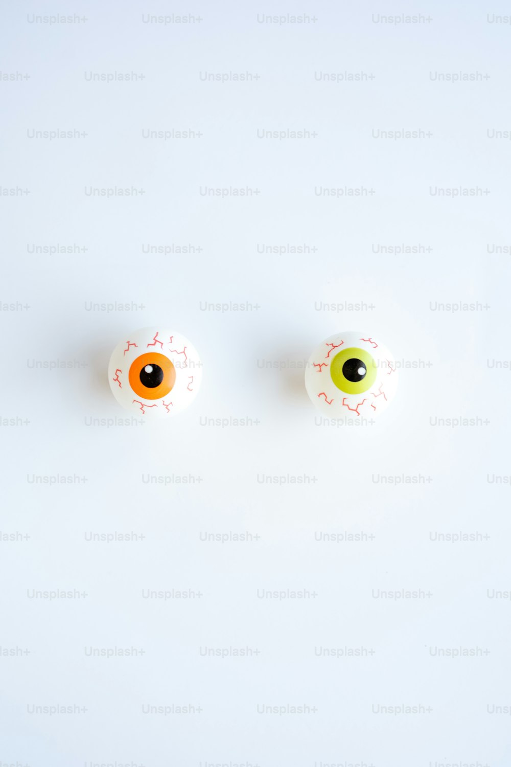 a pair of fake eyeballs sitting on top of a table
