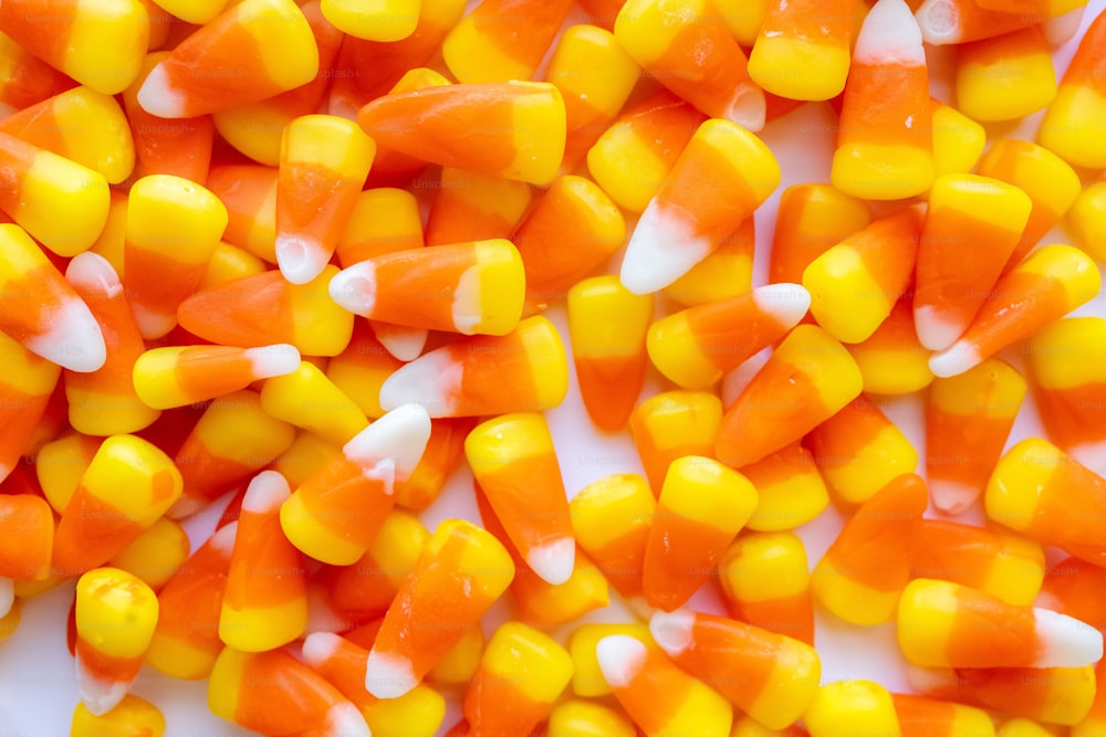 a pile of orange and yellow candy corn