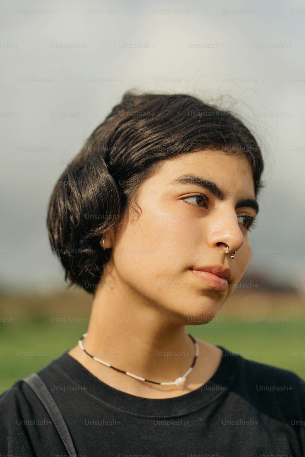 a young woman with a nose piercing