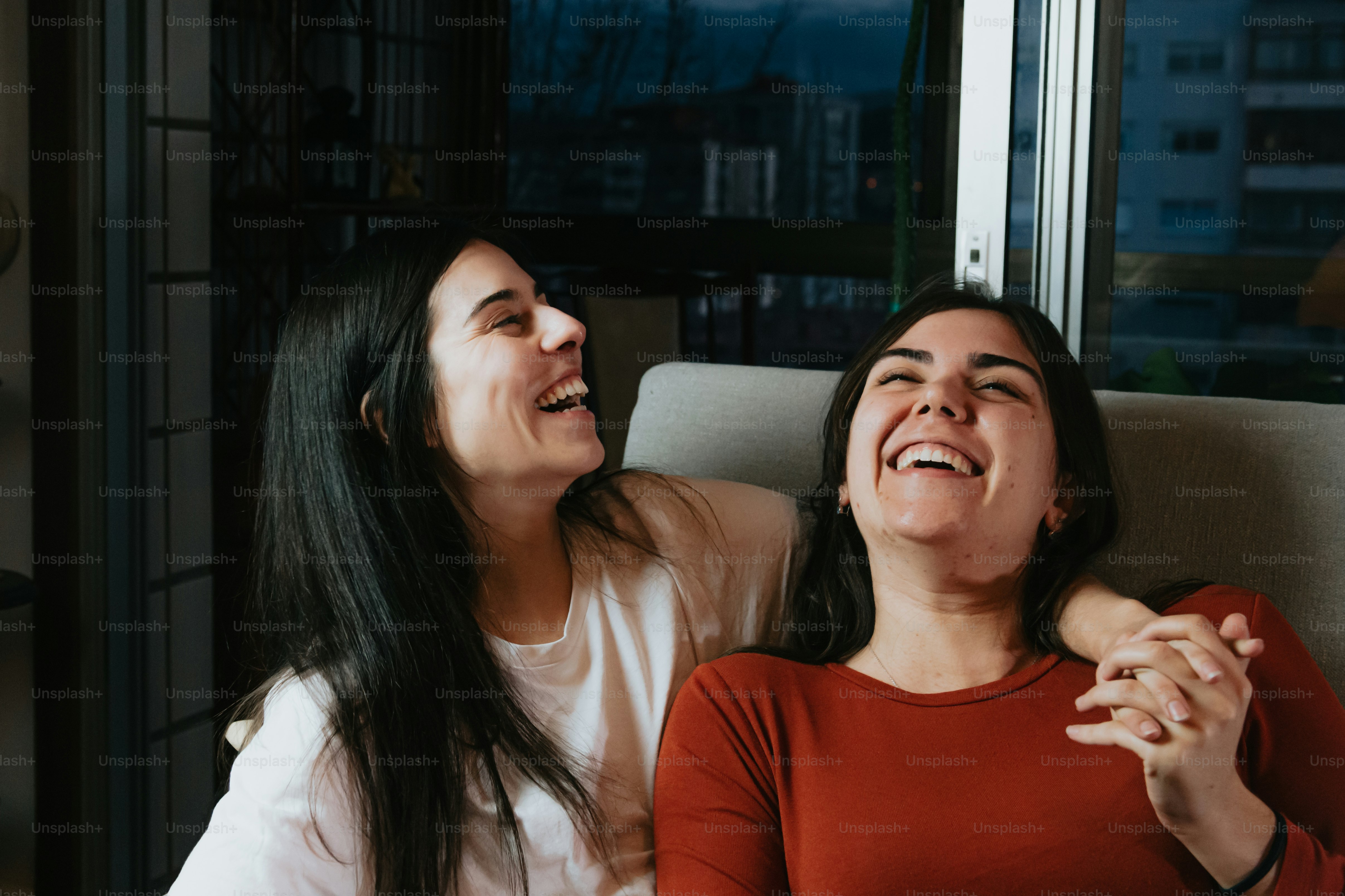a couple of women sitting next to each other