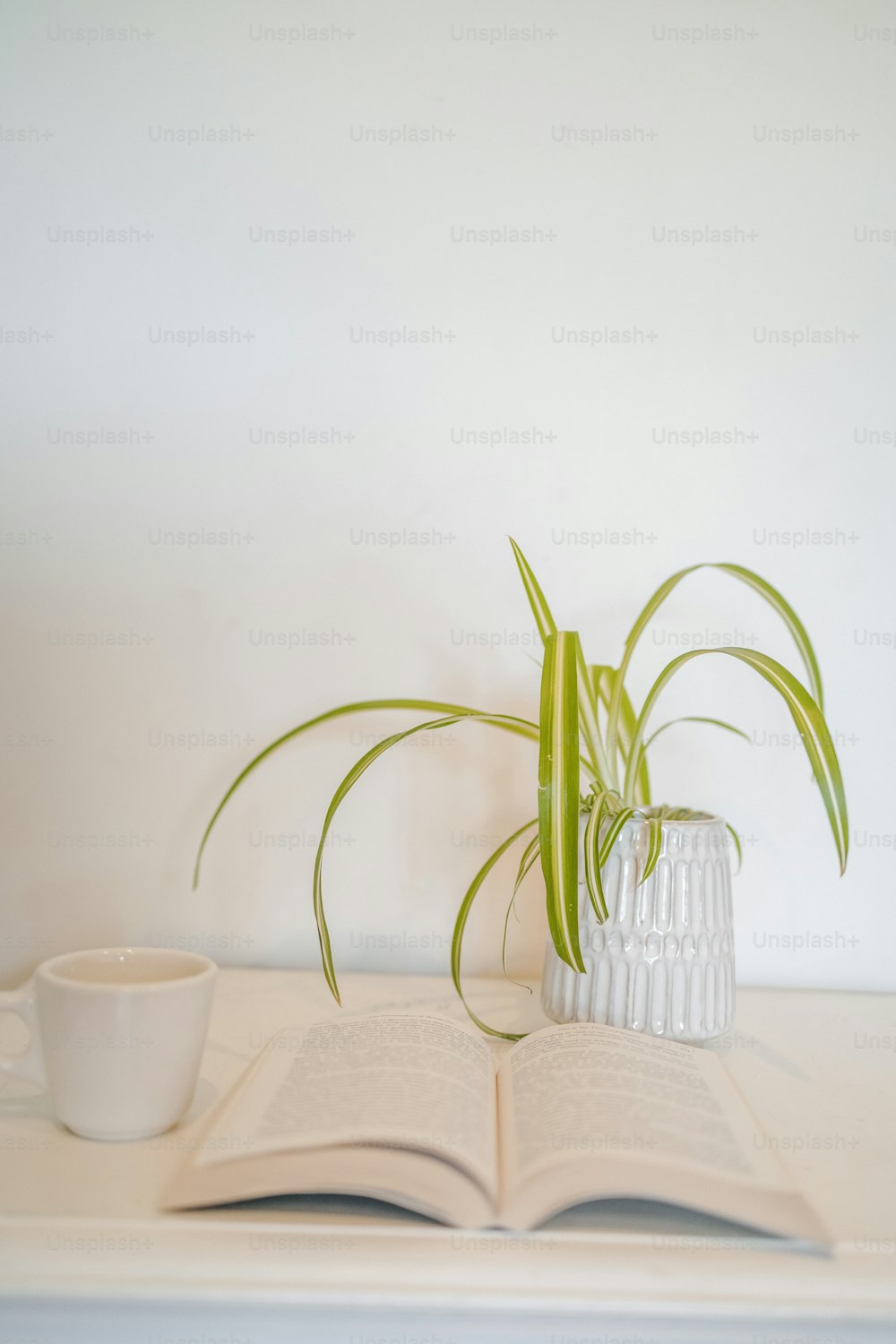 a book and a cup on a table