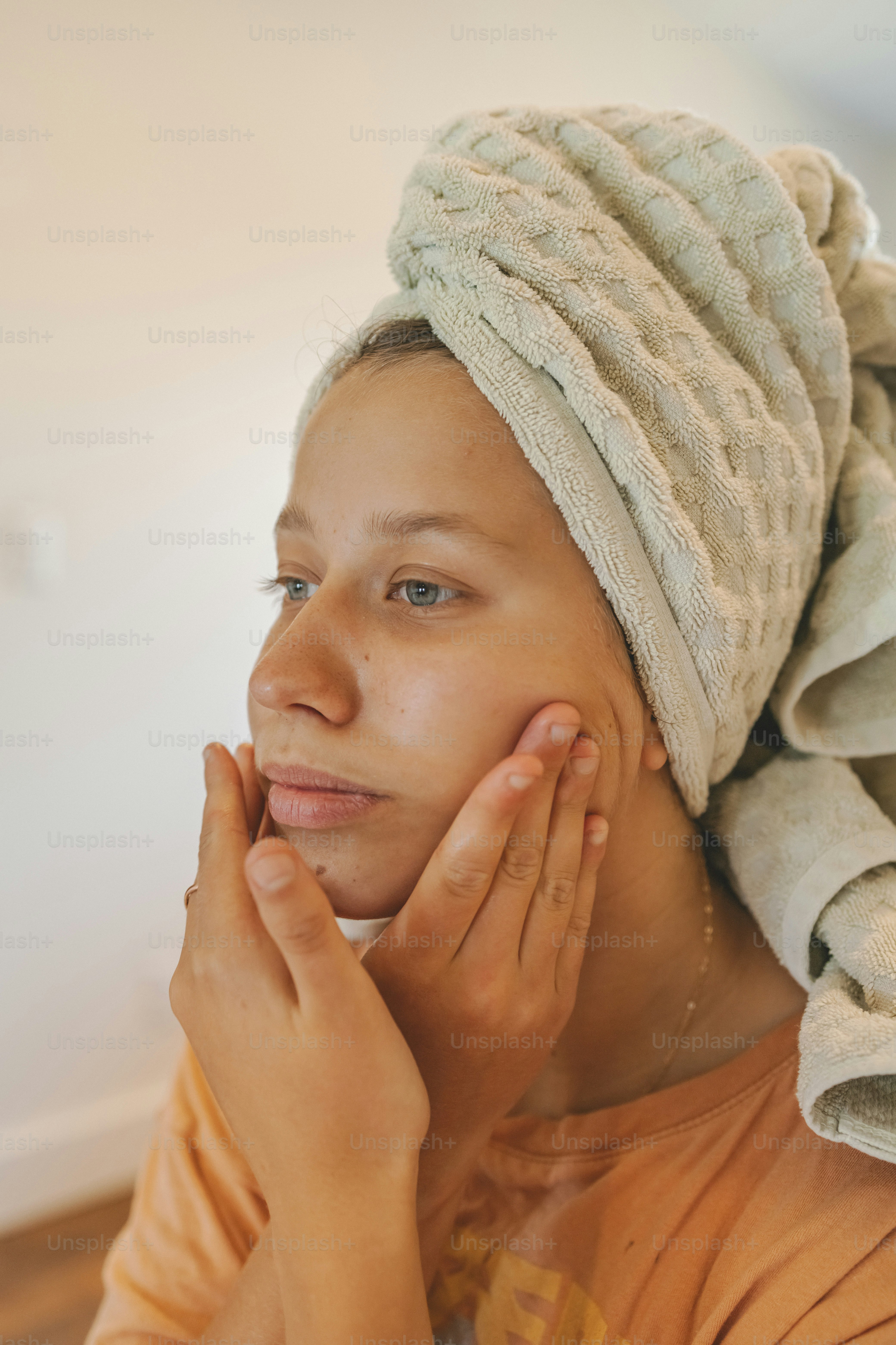 a woman with a towel on her head