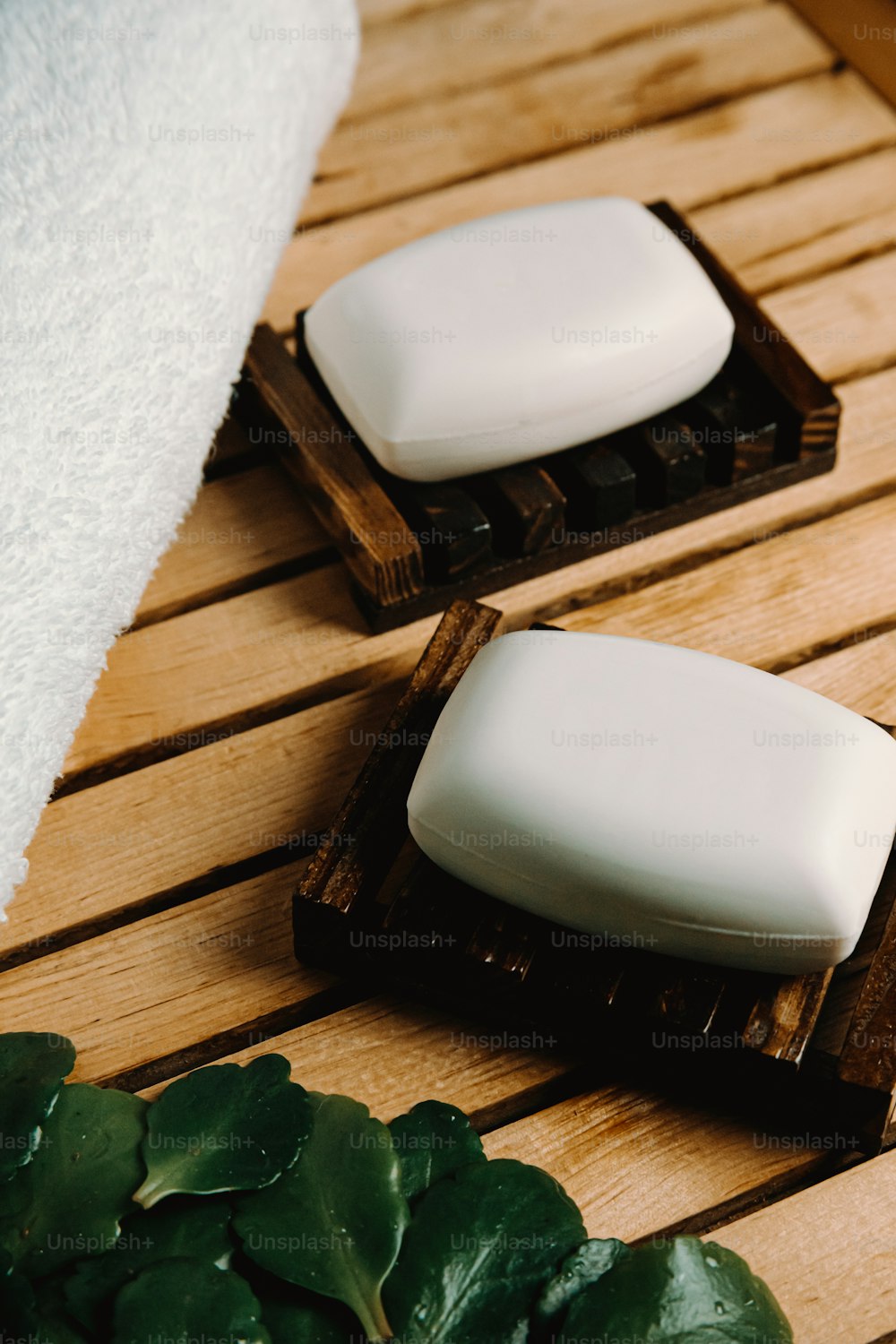 a couple of soaps sitting on top of a wooden table