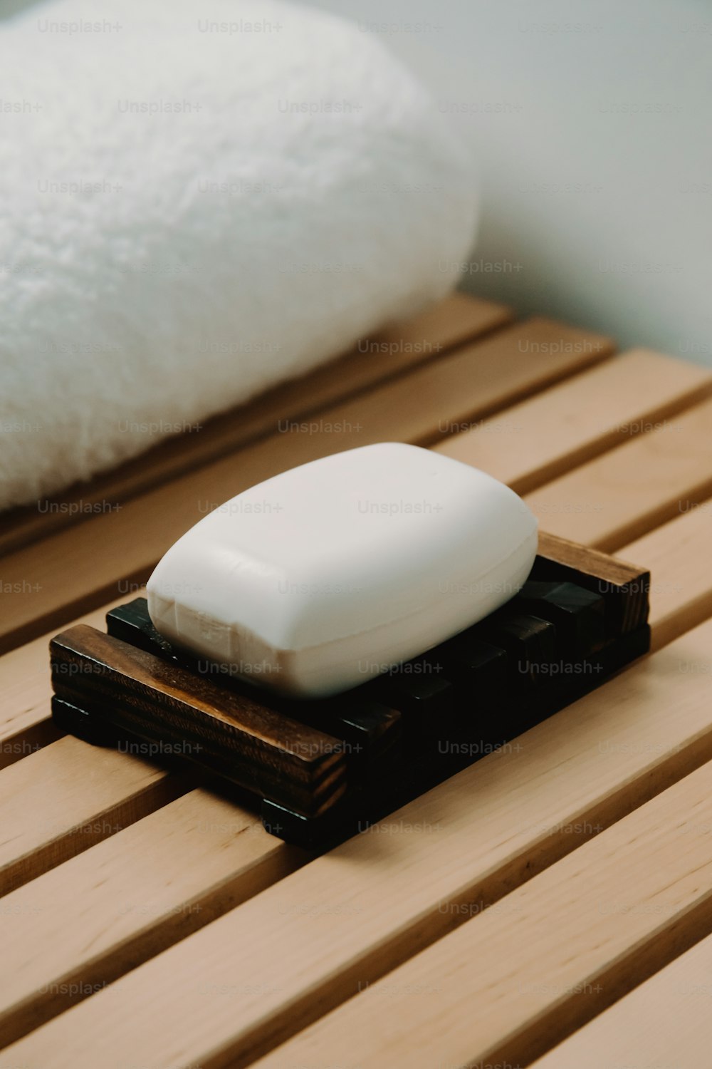 a white soap sitting on top of a wooden table
