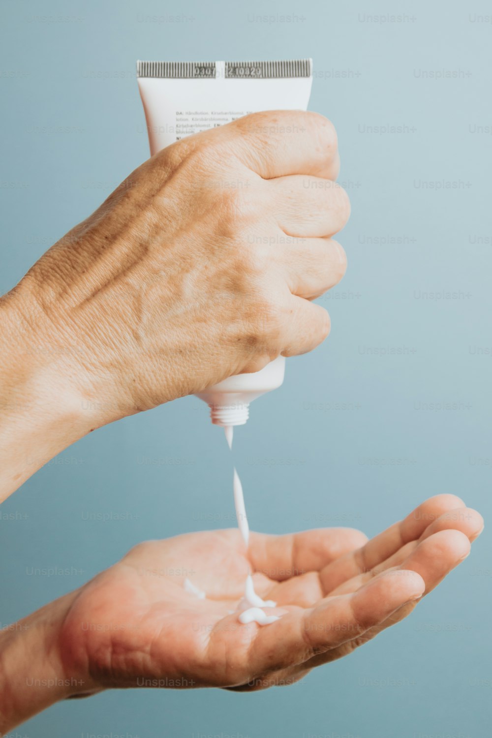 a person holding a toothbrush in their hand