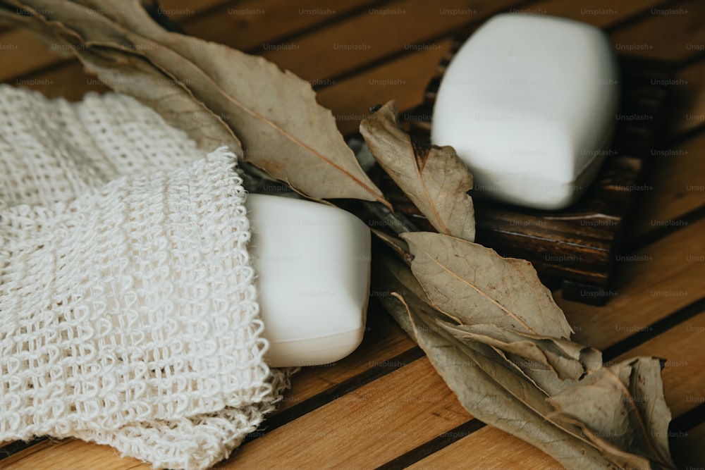 a couple of soaps sitting on top of a wooden table