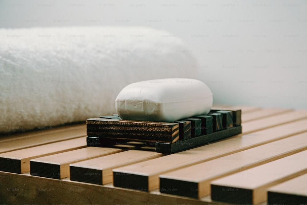 a soap bar sitting on top of a wooden table