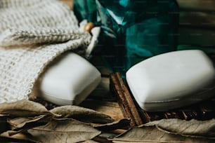 a couple of soaps sitting on top of a wooden table