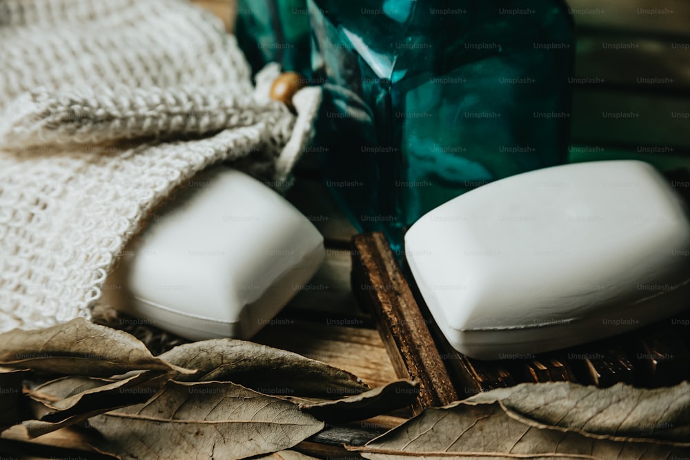 a couple of soaps sitting on top of a wooden table