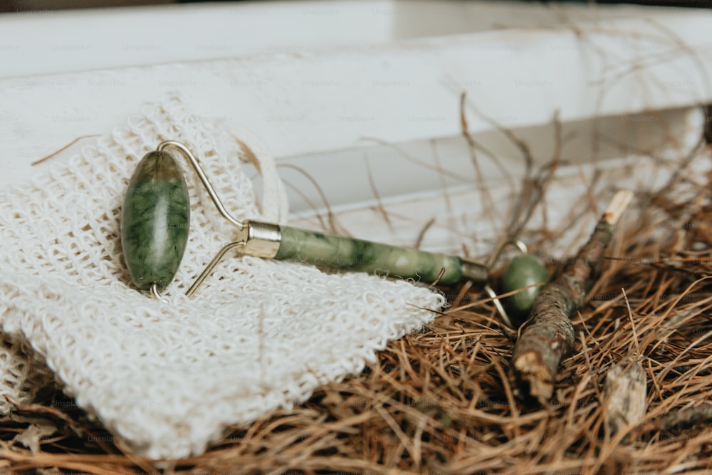 a close up of a green object on a cloth