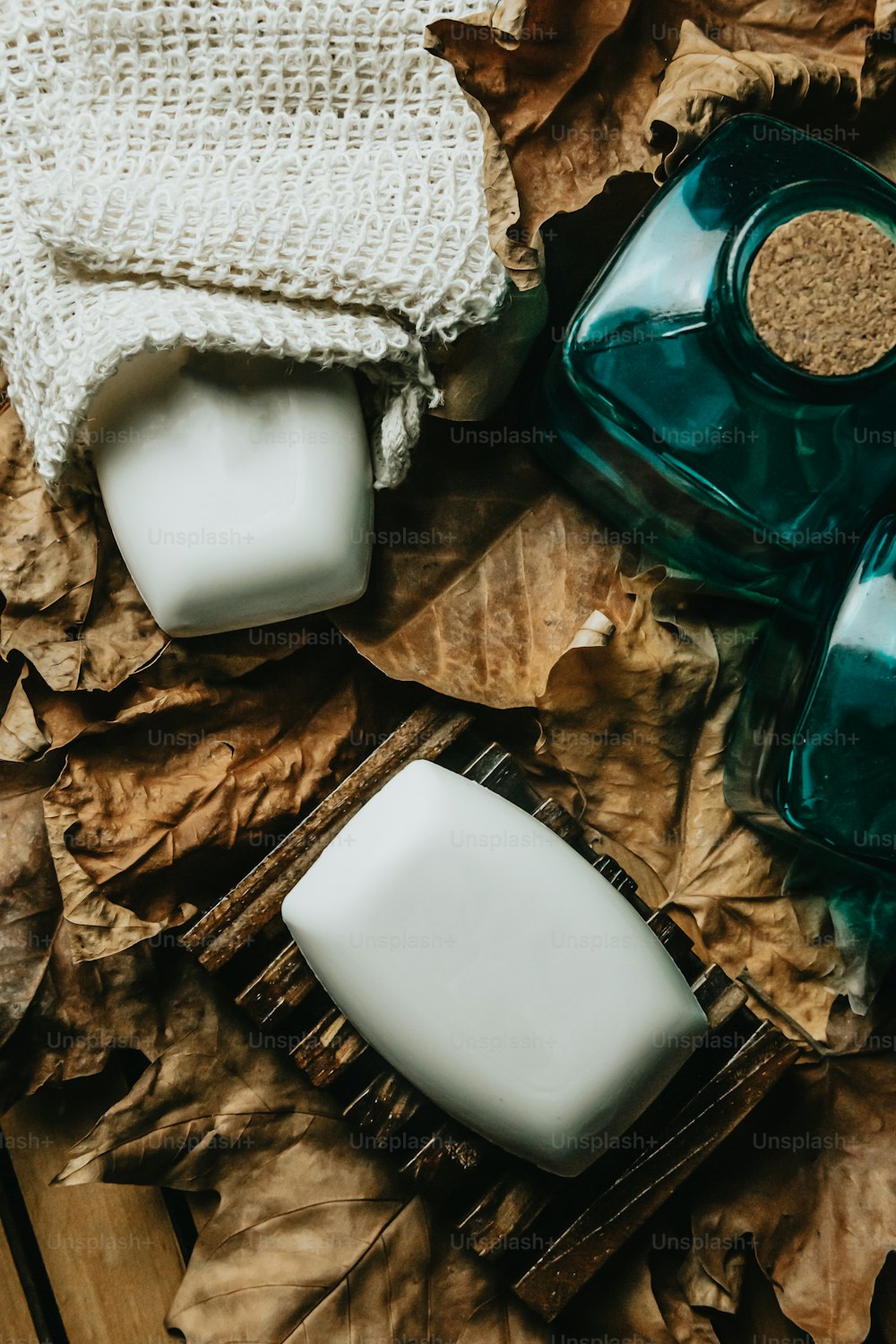 a couple of soaps sitting on top of a wooden table