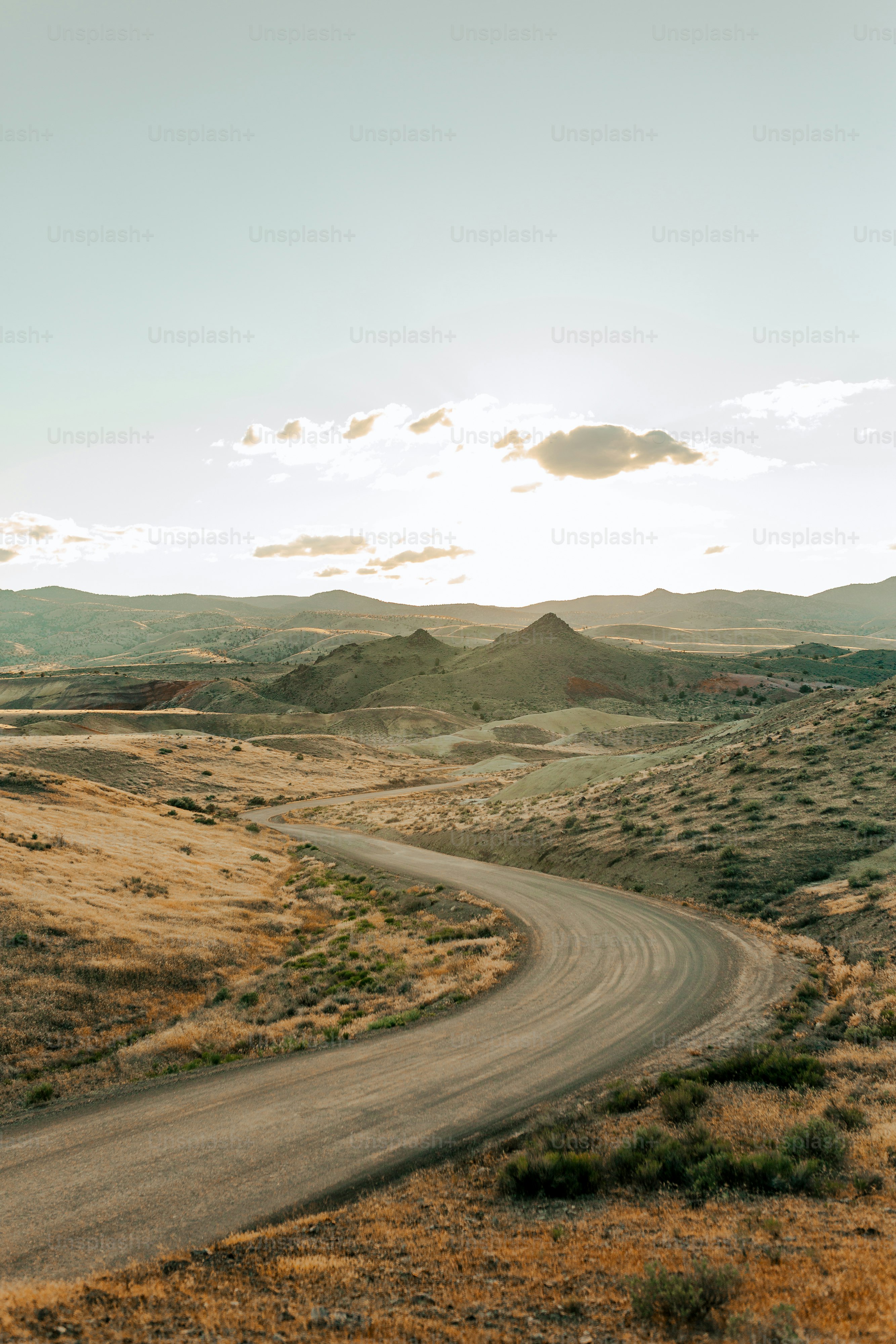 a winding road in the middle of a desert
