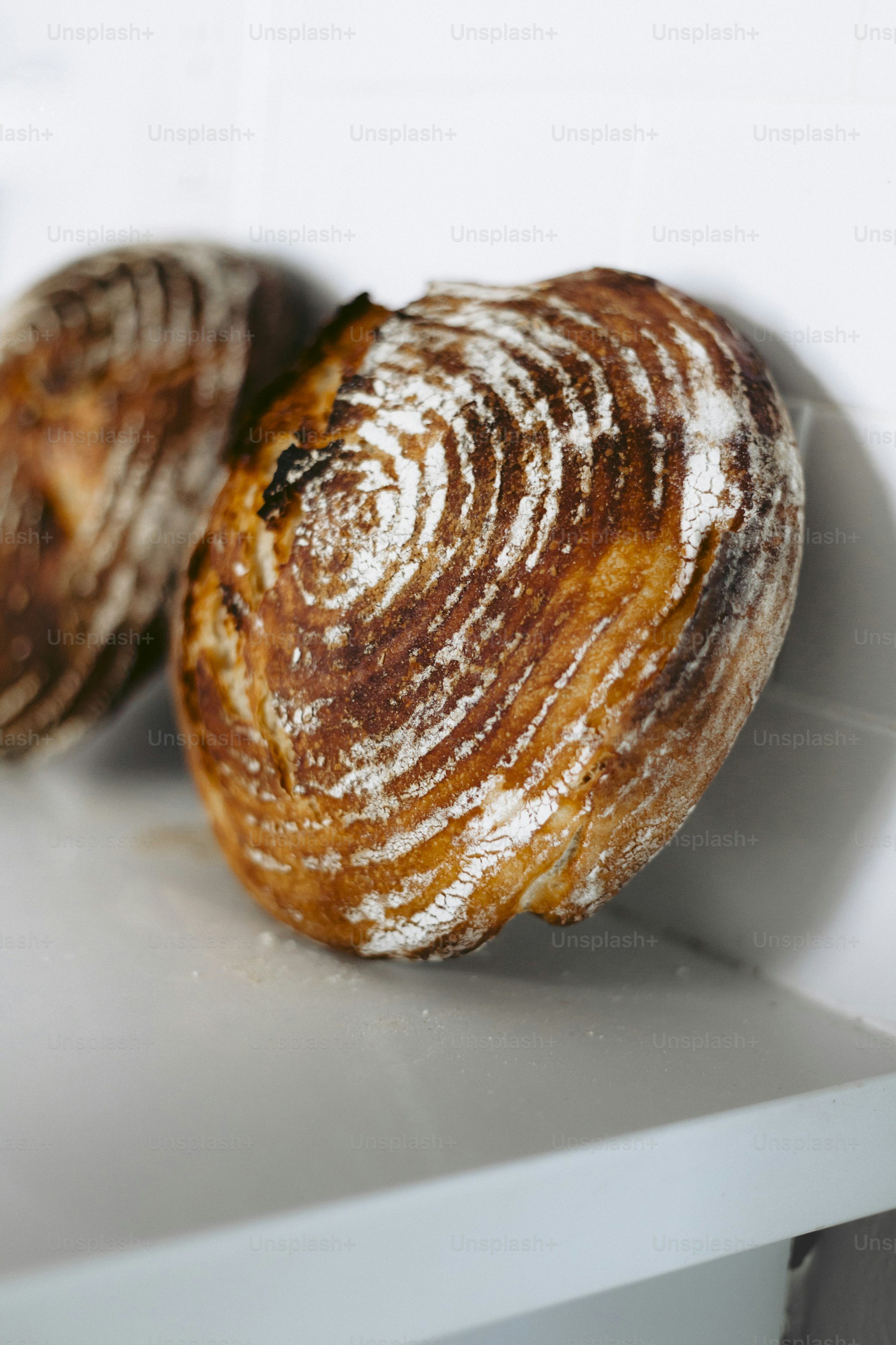 a couple of doughnuts sitting on top of a counter