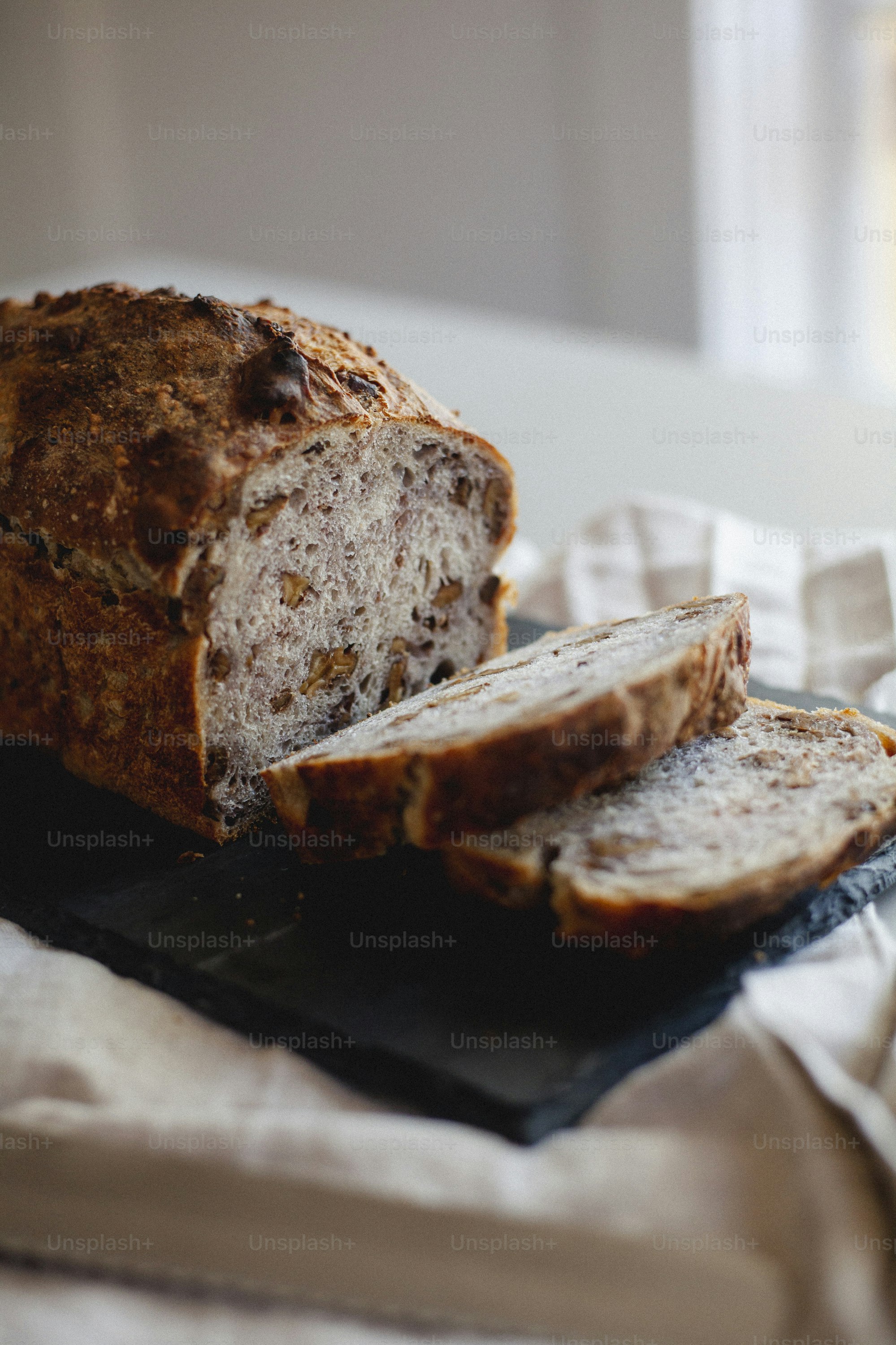 a loaf of bread sitting on top of a cutting board