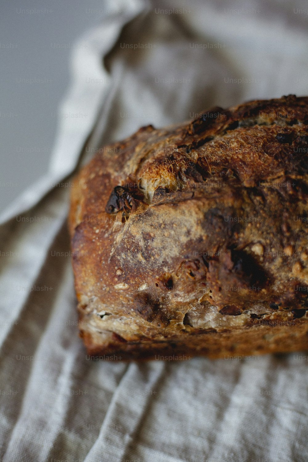 a loaf of bread sitting on top of a white cloth