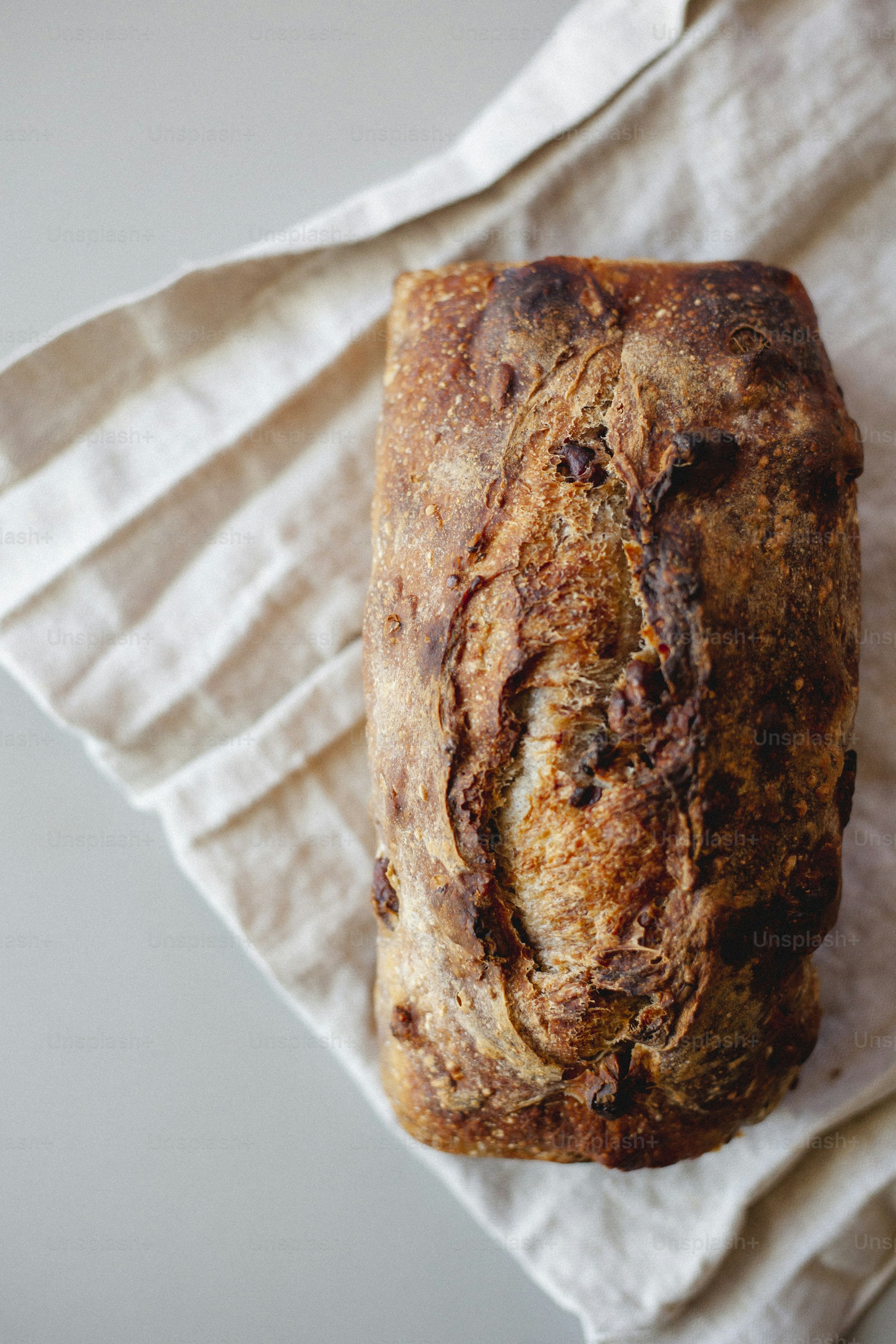 a loaf of bread sitting on top of a napkin