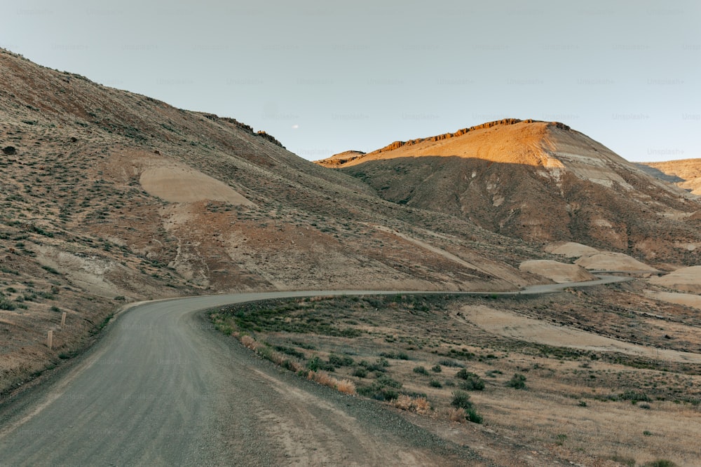 a winding road in the middle of a desert