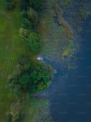 an aerial view of a boat on a lake