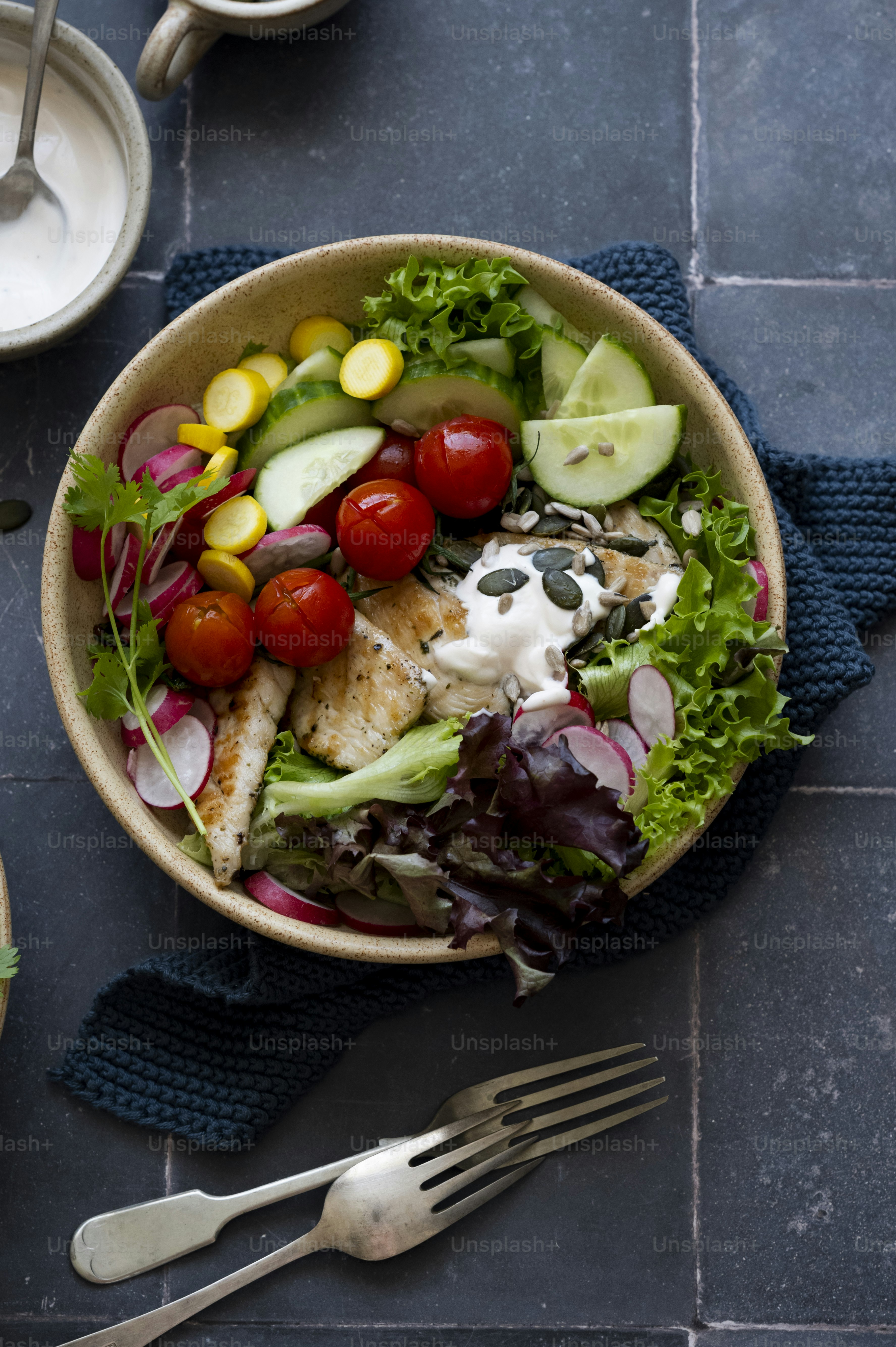 a bowl of food with a fork and knife