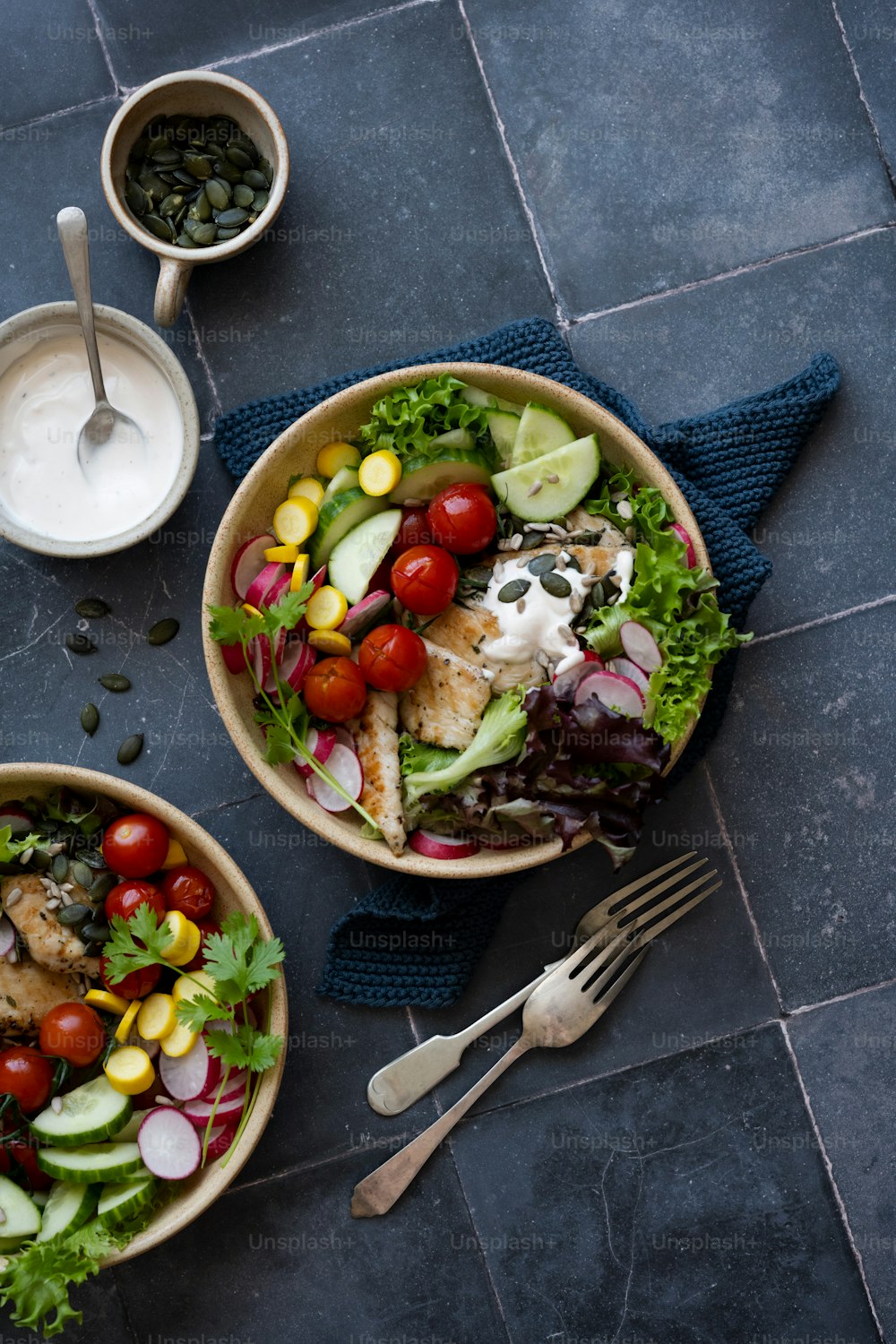 a couple of bowls of food on a table