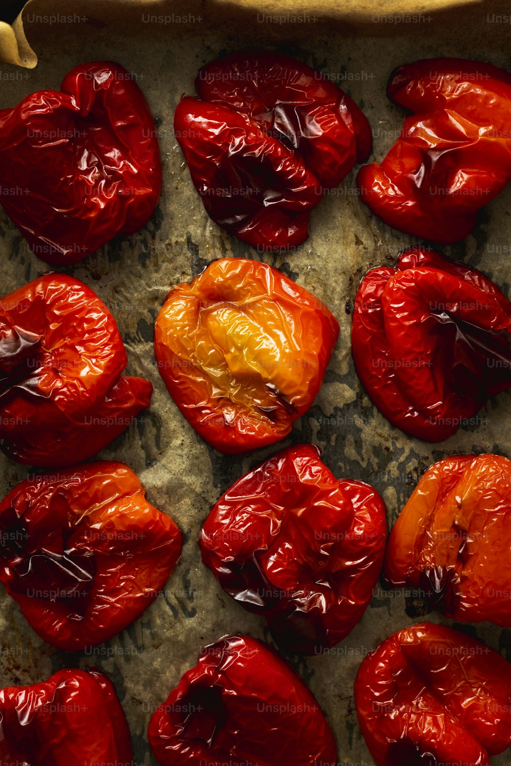 a bunch of red peppers sitting on top of a counter