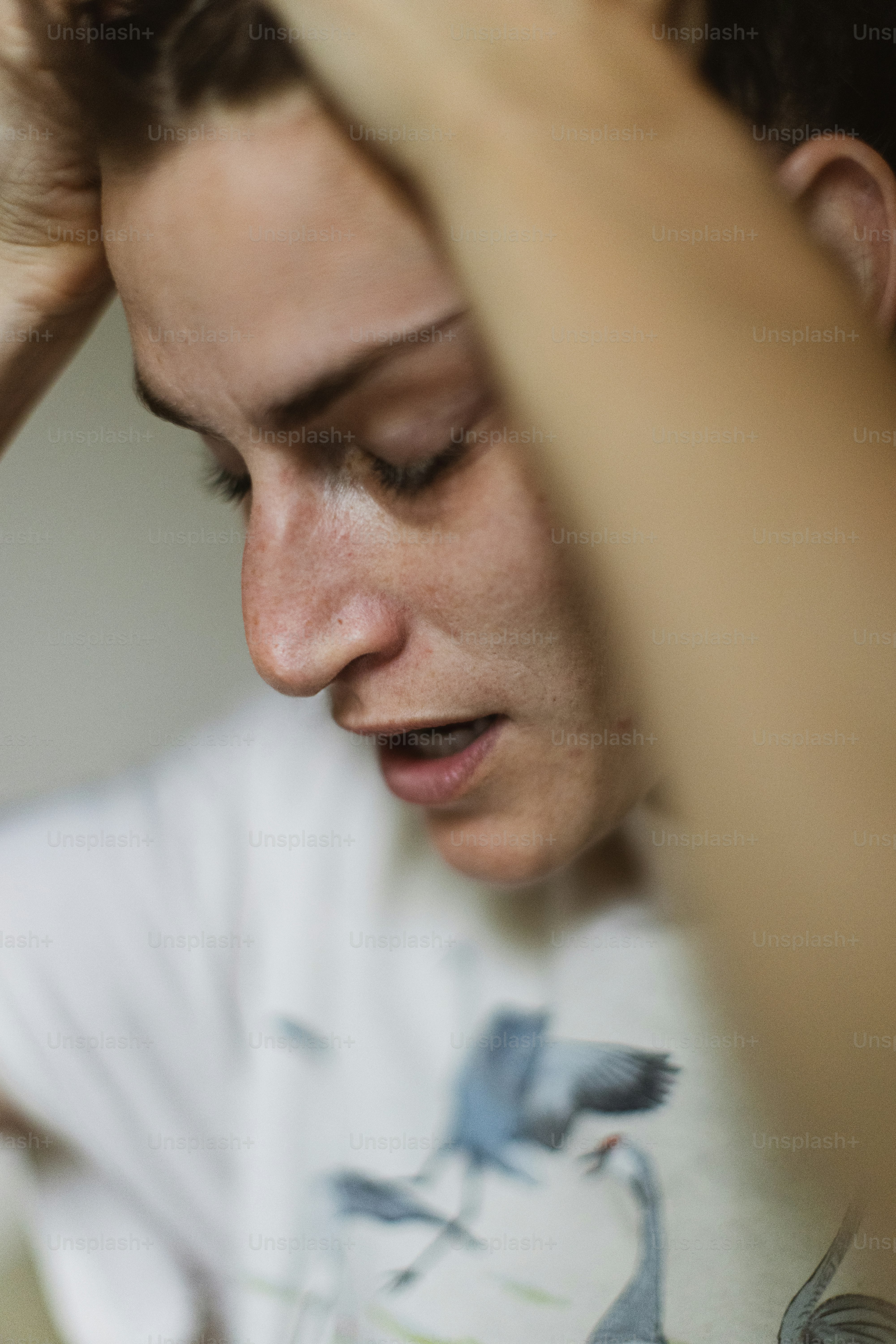 a woman holding her hair in her hands