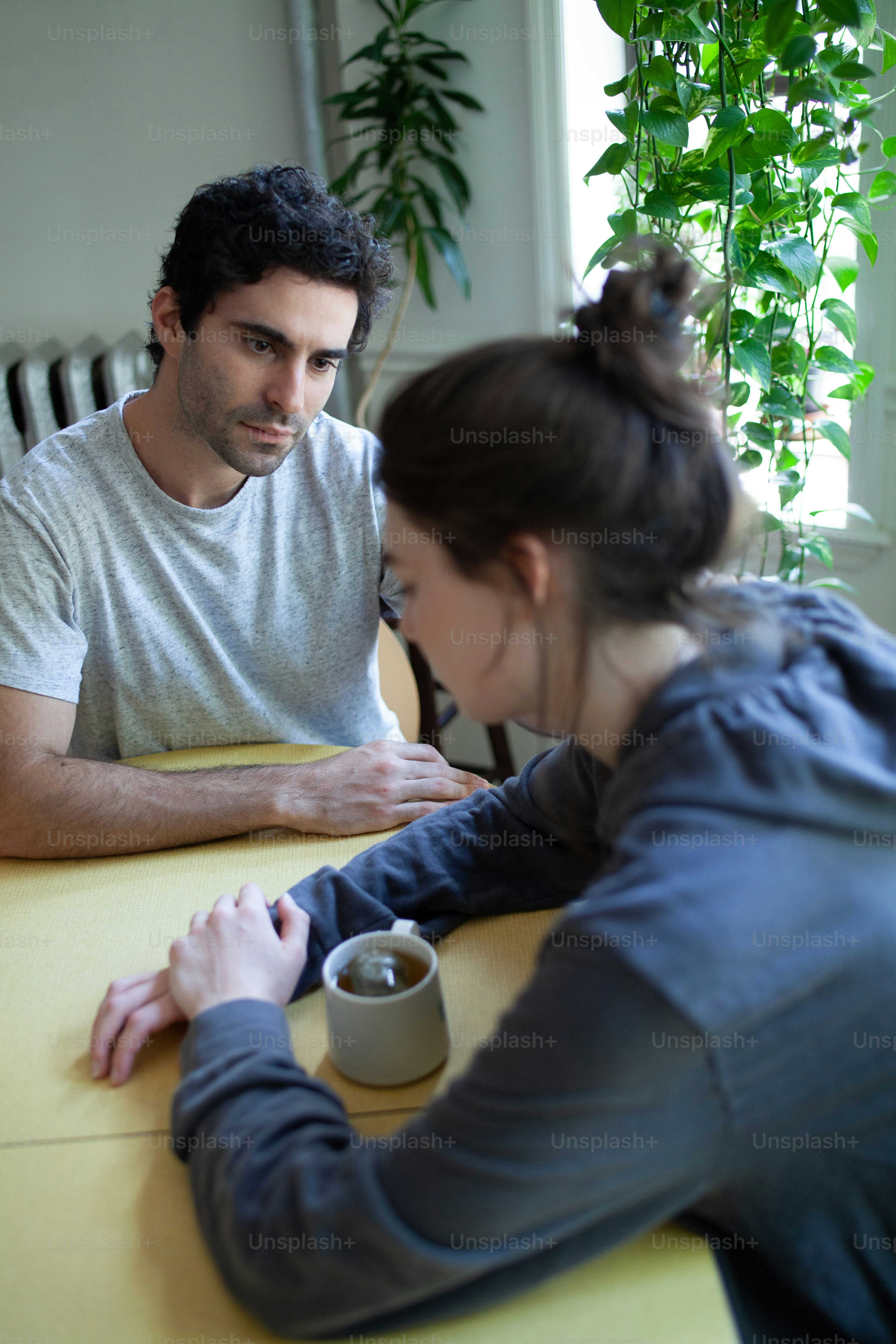 a man and a woman sitting at a table