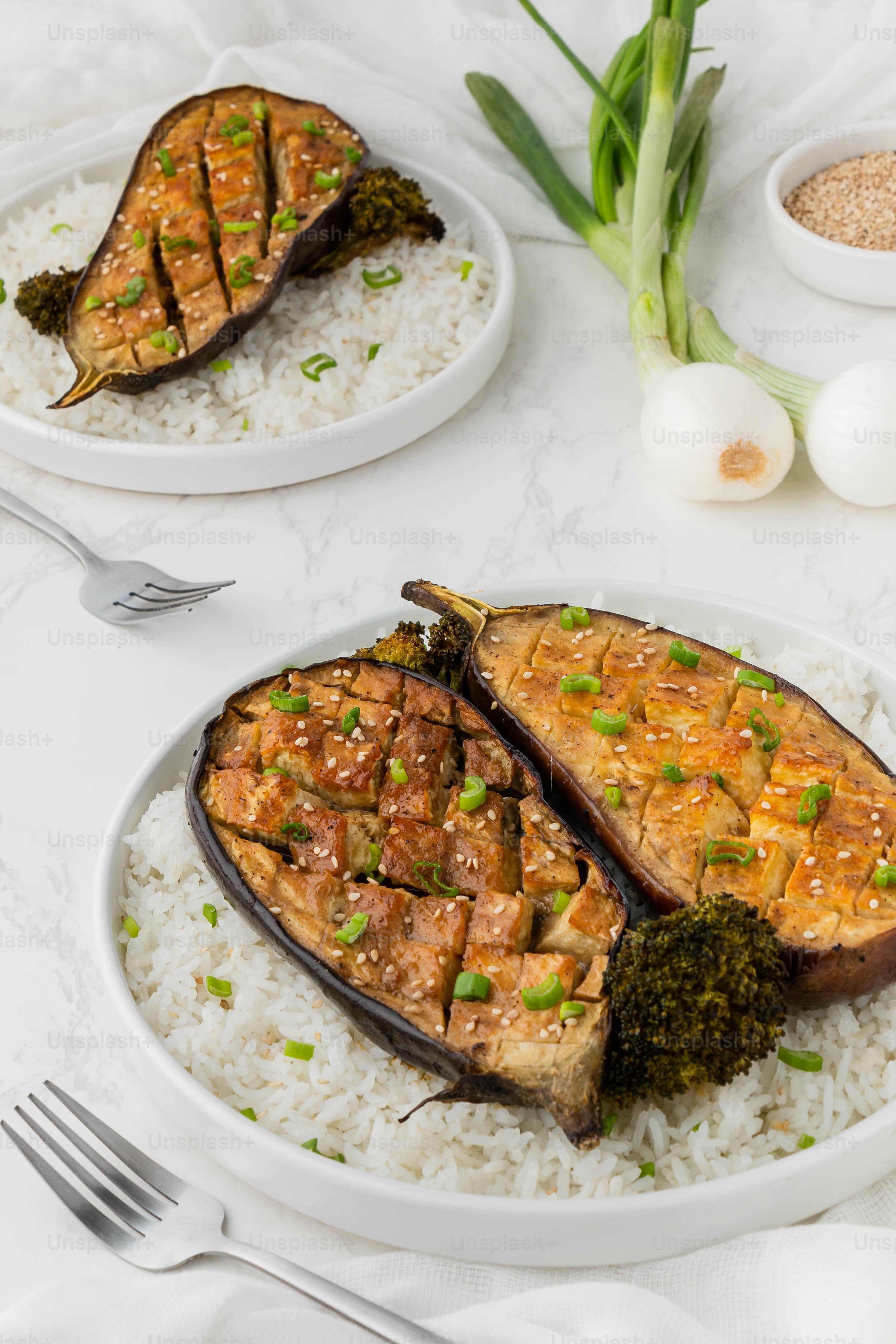 a plate of food with rice and broccoli on it