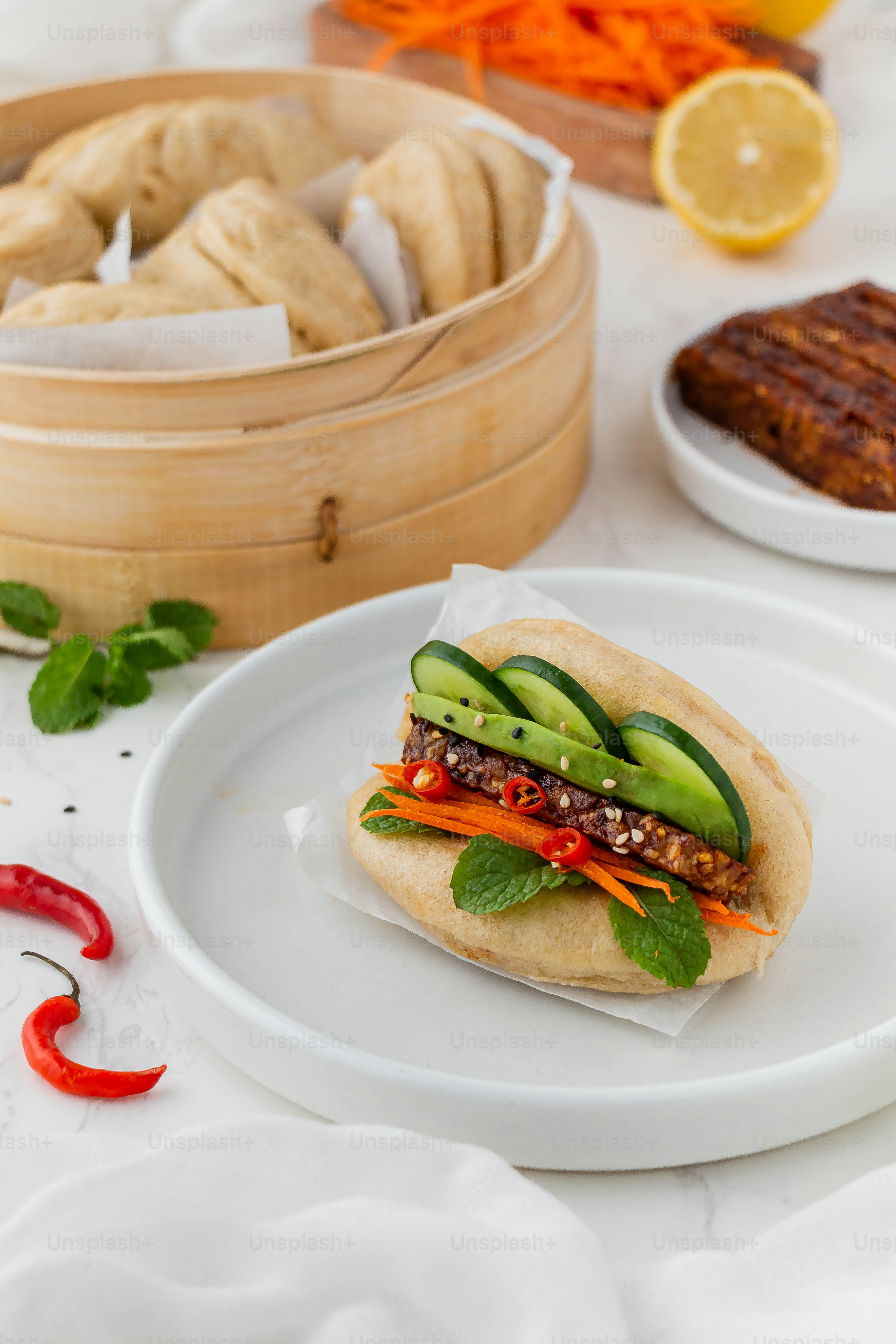 a white plate topped with a sandwich on top of a table