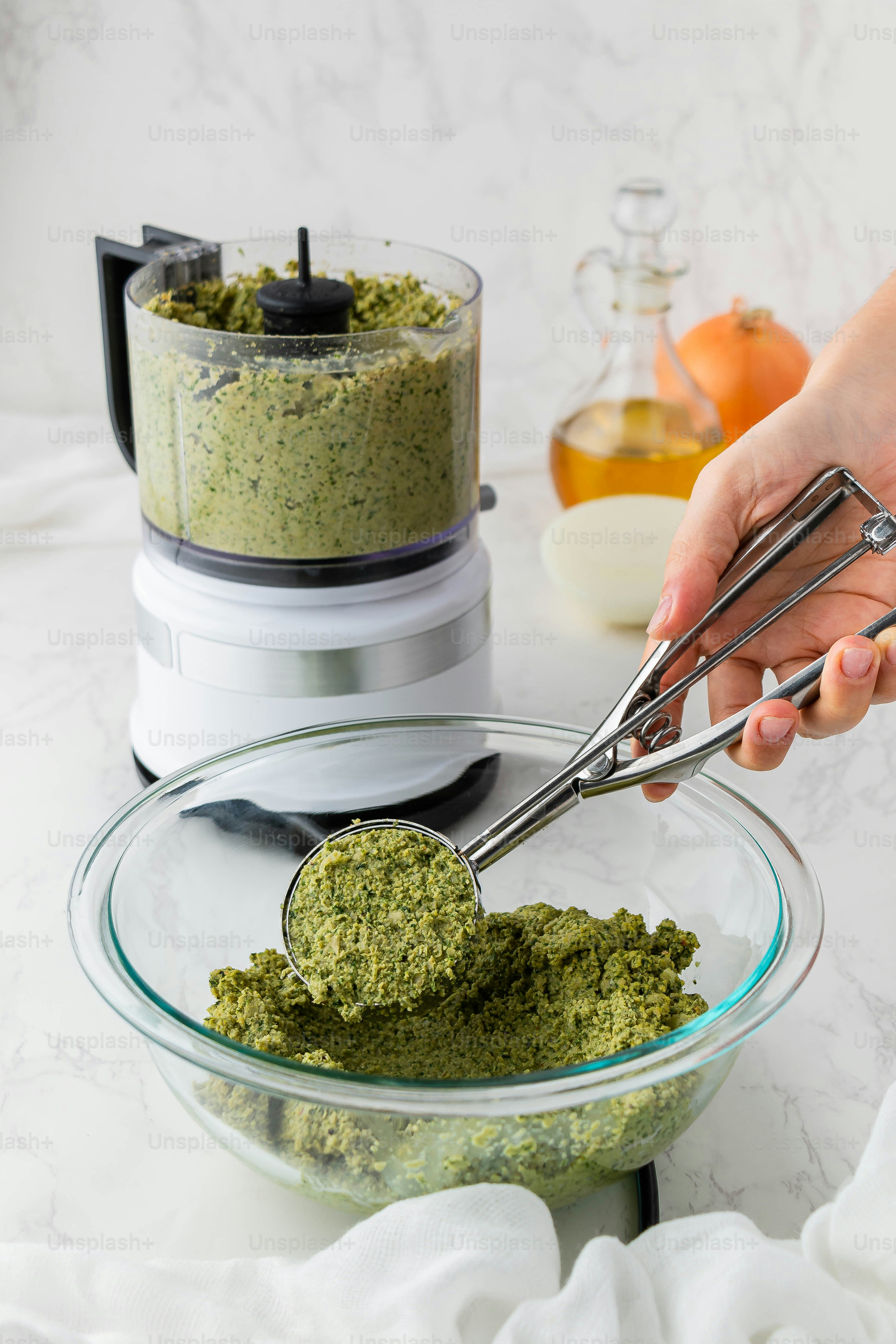 a person mixing a mixture in a bowl