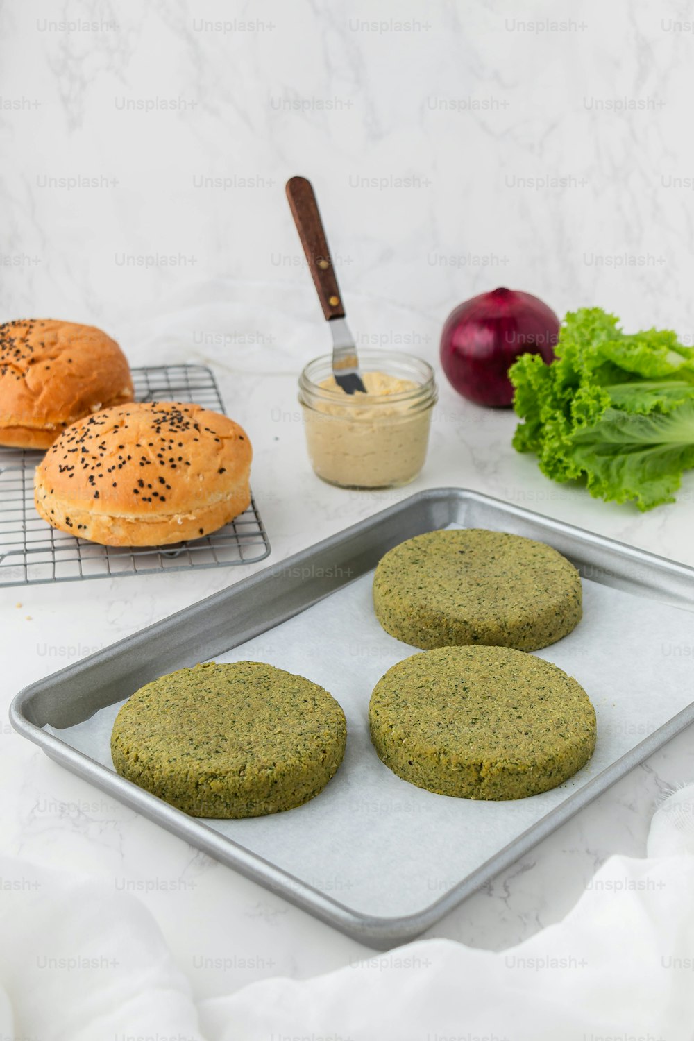 a baking tray with cookies and vegetables on it