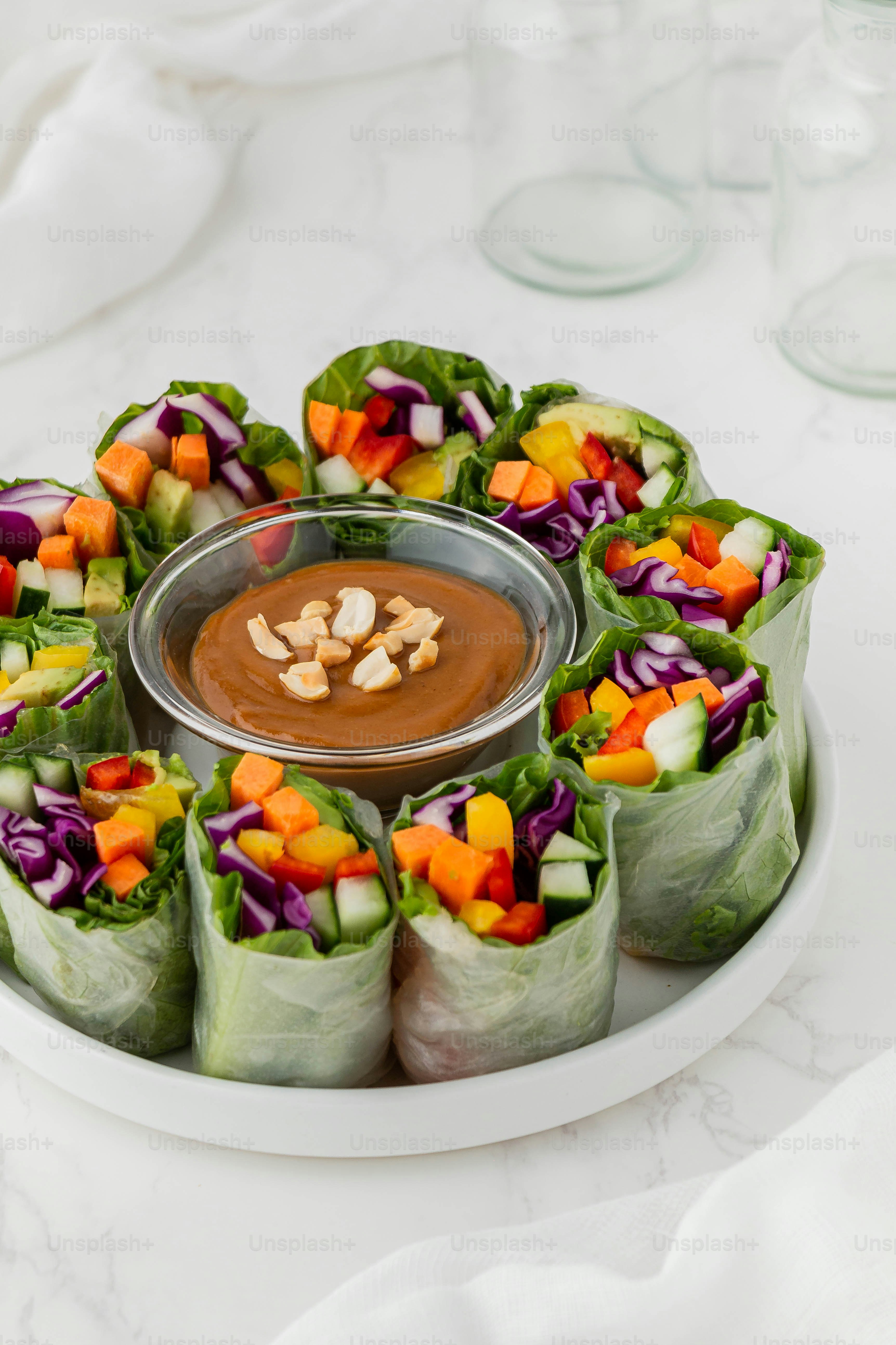 a plate of food with a dipping sauce on top of it