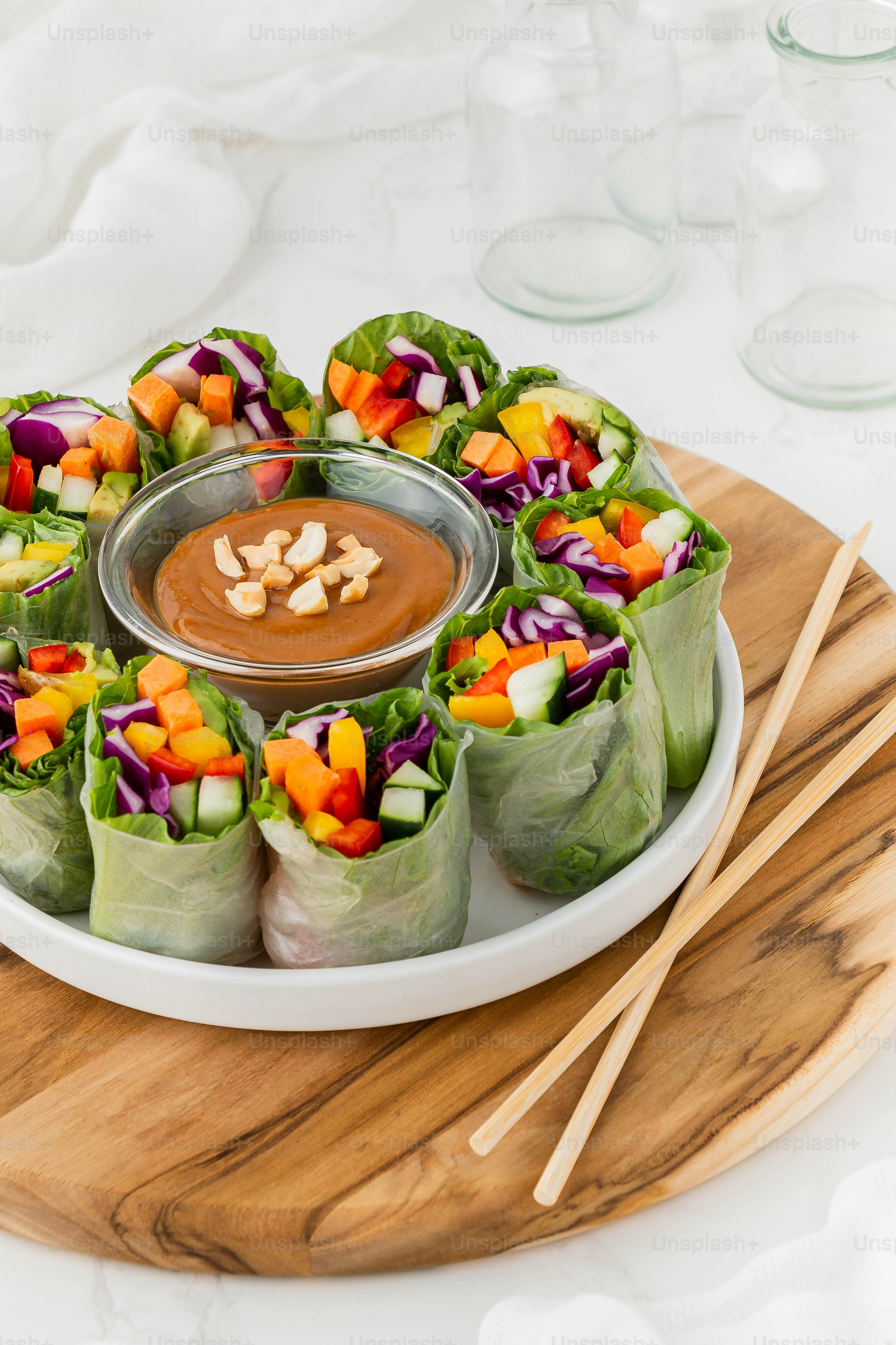 a plate of food with a dipping sauce on top of it