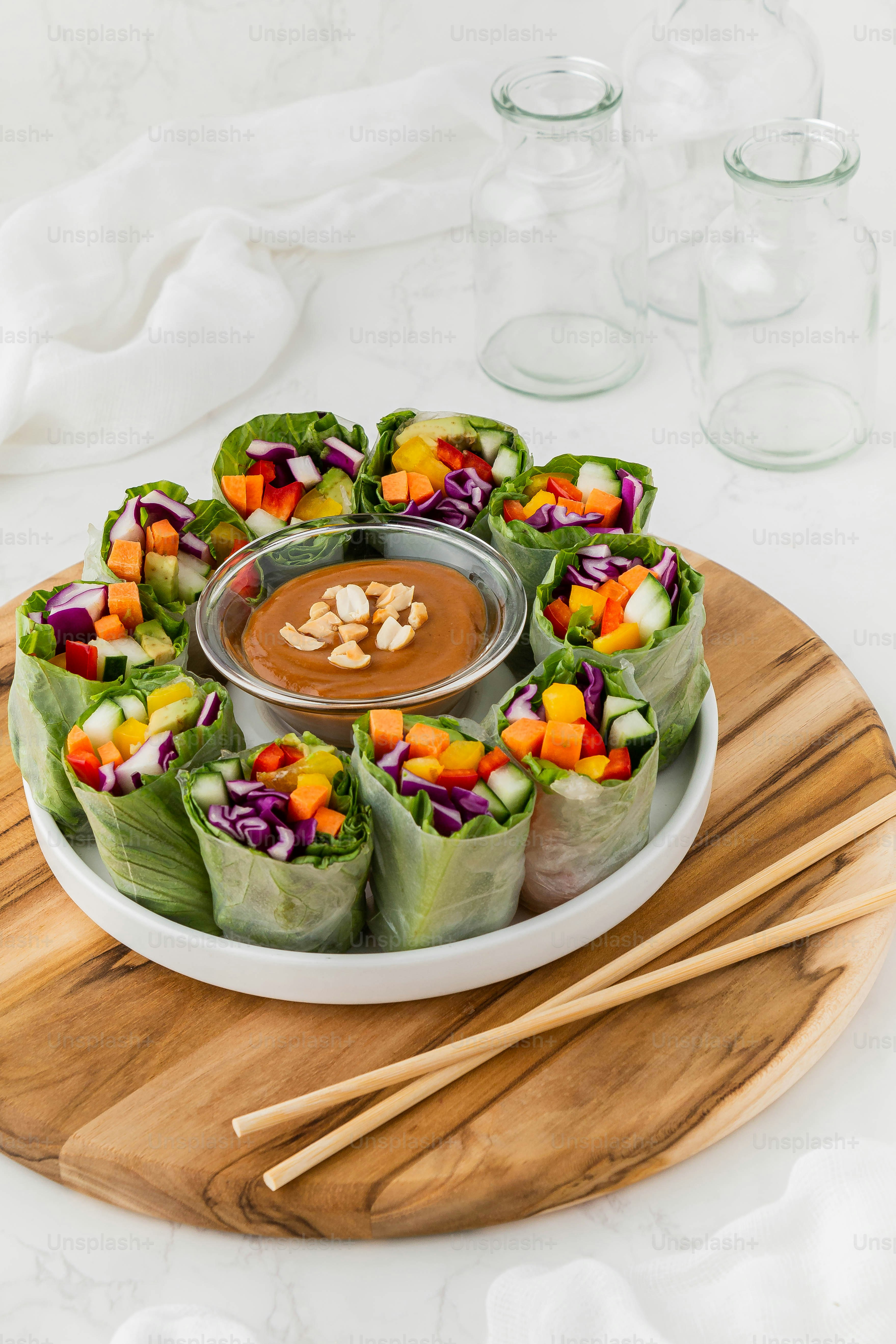 a plate of food with a dipping sauce on top of it