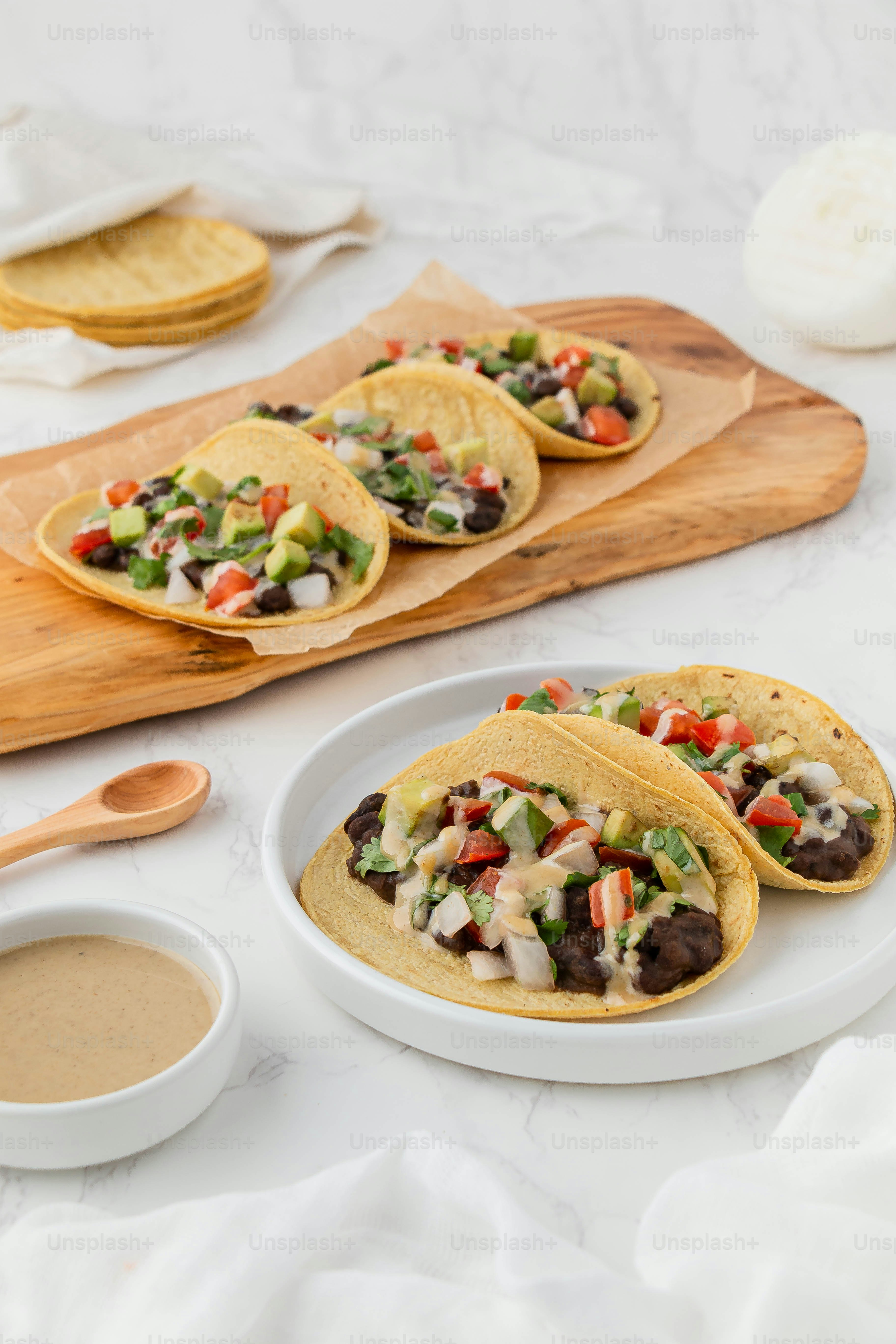 Three tacos on a plate with dipping sauce photo Mexican food Image on