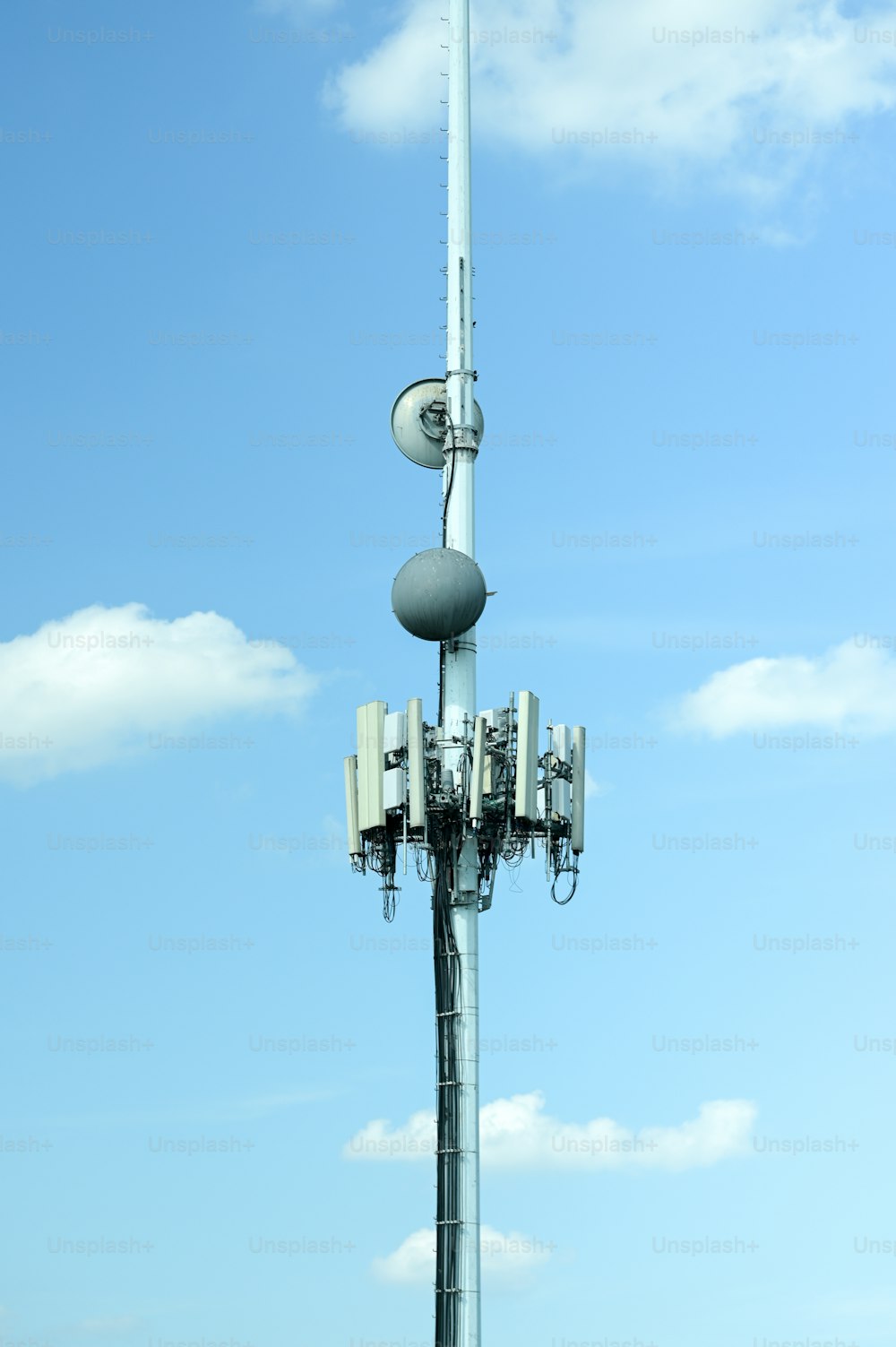 a cell phone tower with a sky background