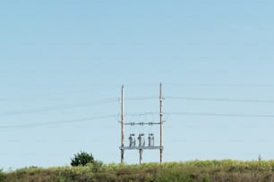 a telephone pole with three cell phones on top of it