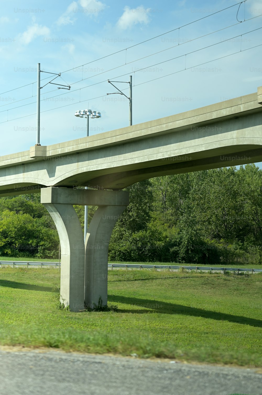a highway overpass with power lines above it