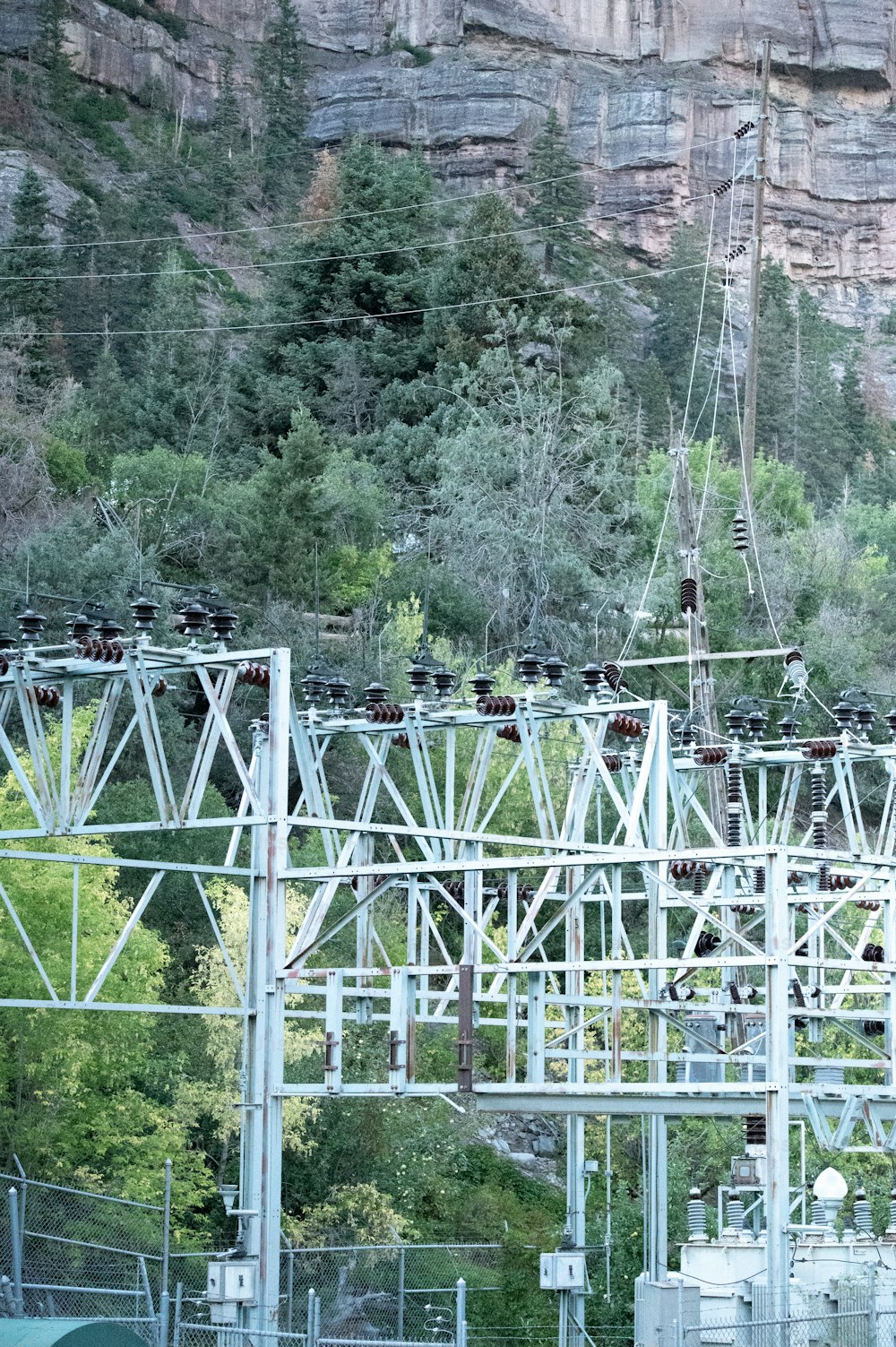 a train on a train track with a mountain in the background