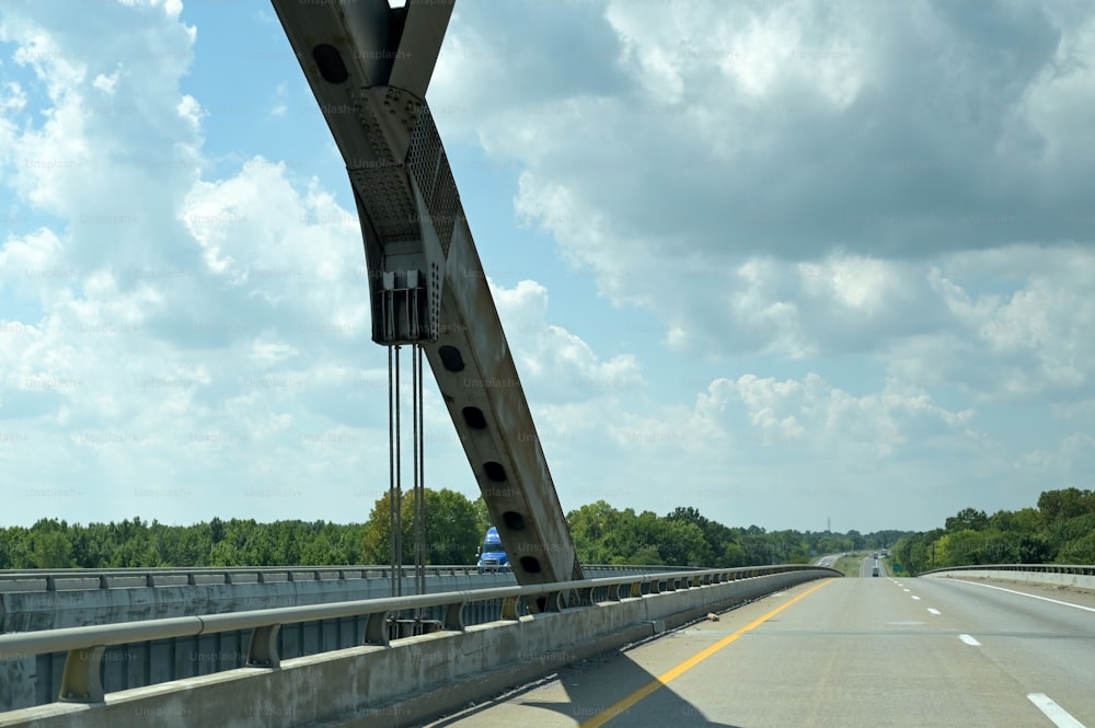 a view of a bridge from the inside of a car