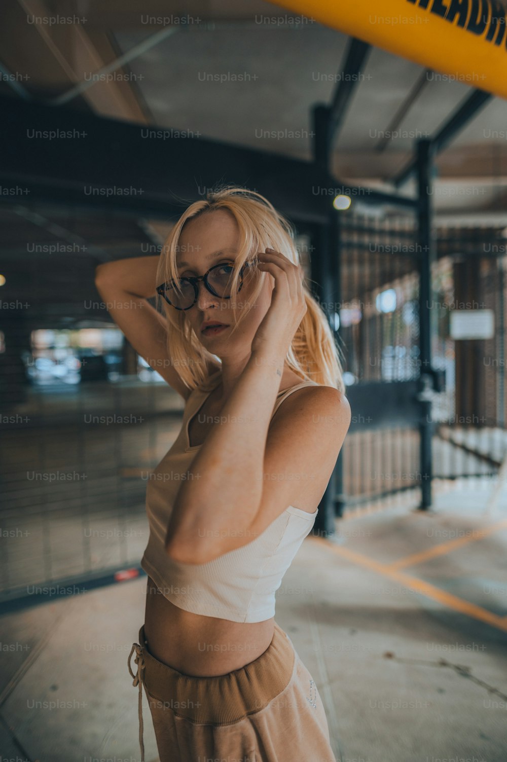 a woman in a white top and brown skirt